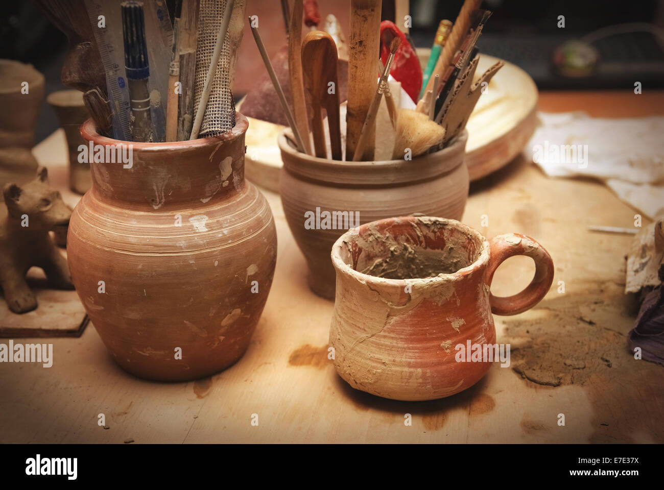 Handmade old clay pots with other stuff on the table Stock Photo Alamy