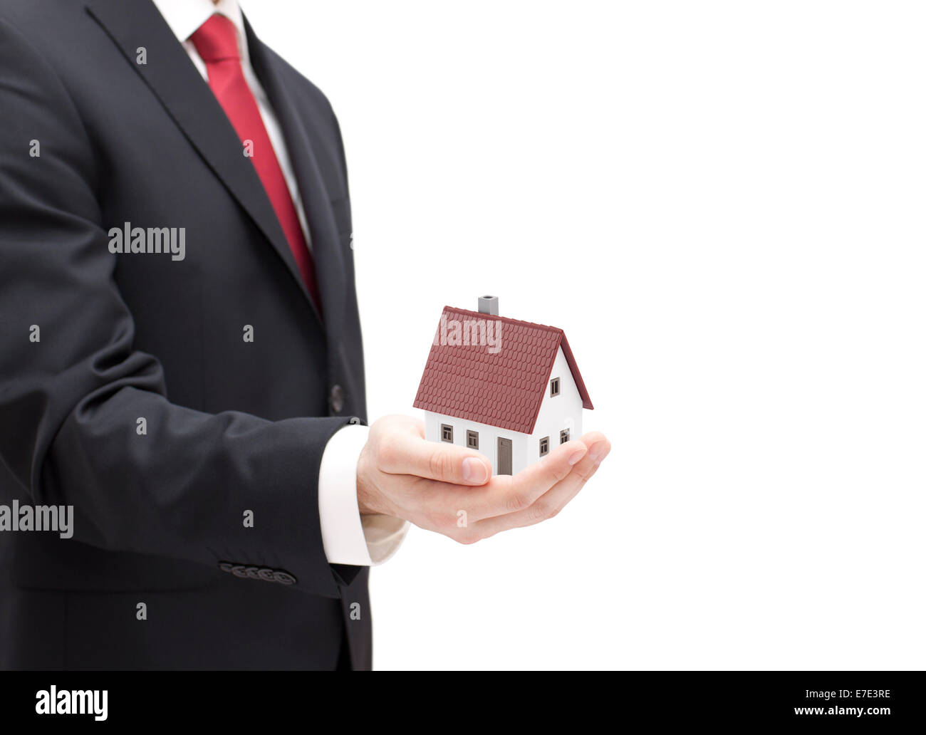 Businessman with house miniature in hand isolated on white Stock Photo