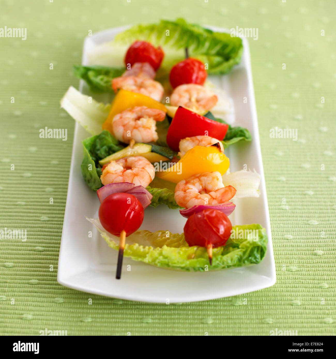 Cooked prawn, tomato and pepper skewers Stock Photo