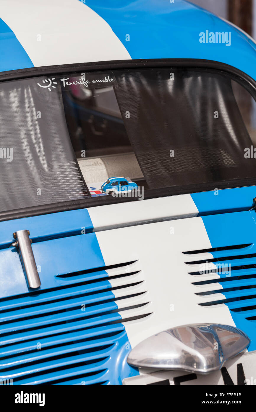 Toy Fiat 500 on the rear shelf in a real Fiat 500, close up looking through the back window, Guia de Isora, Tenerife, Canary Isl Stock Photo