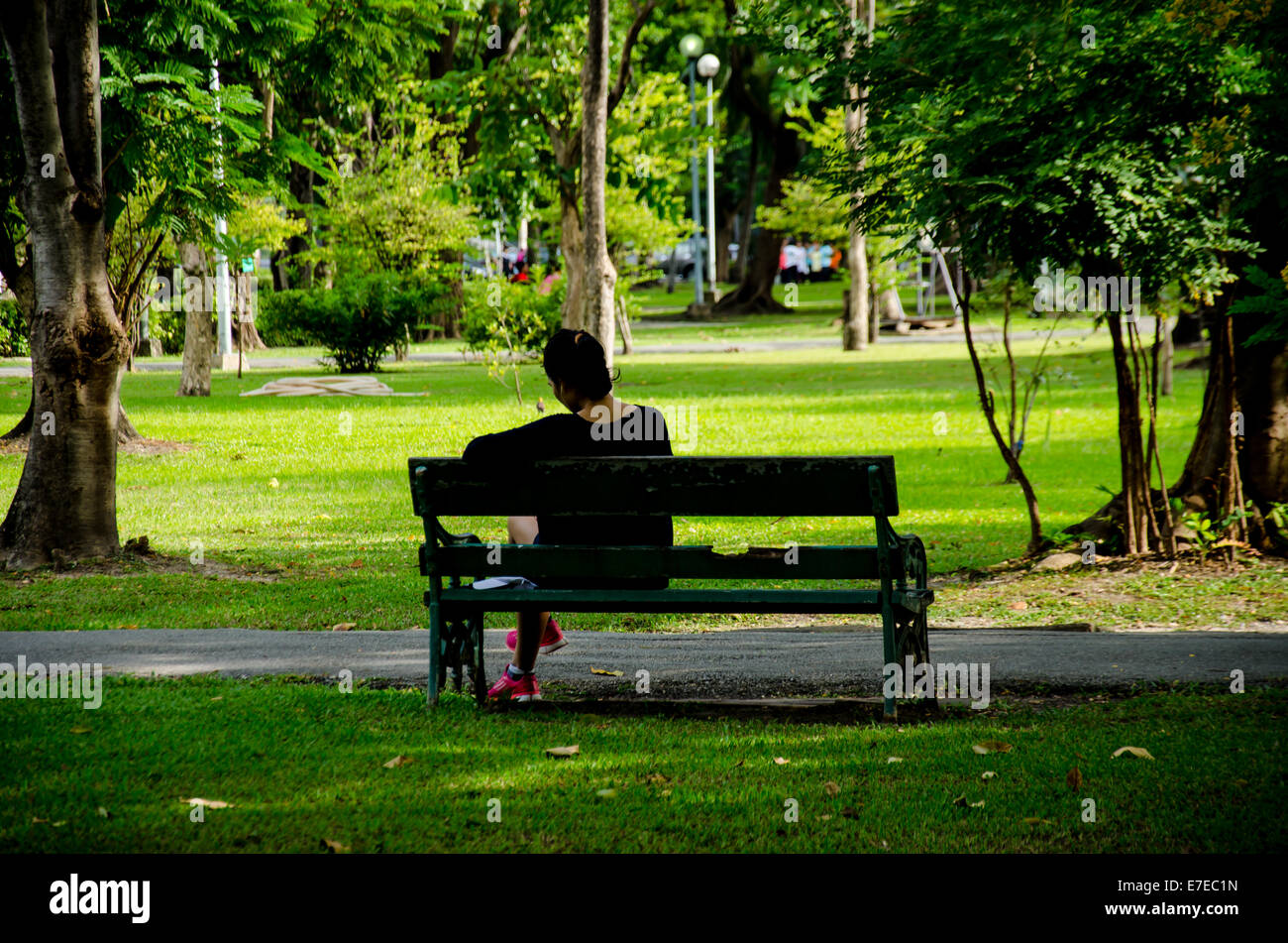 man relax on bench in the park Stock Photo