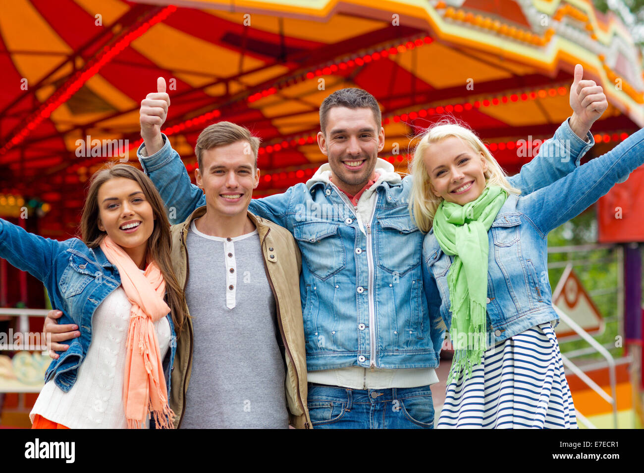 group of smiling friends showing thumbs up Stock Photo - Alamy