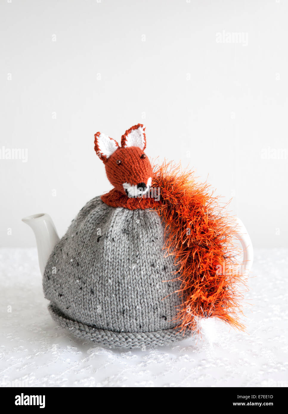 Vintage style handknitted tea cosy with a knitted Fox on the top Stock Photo