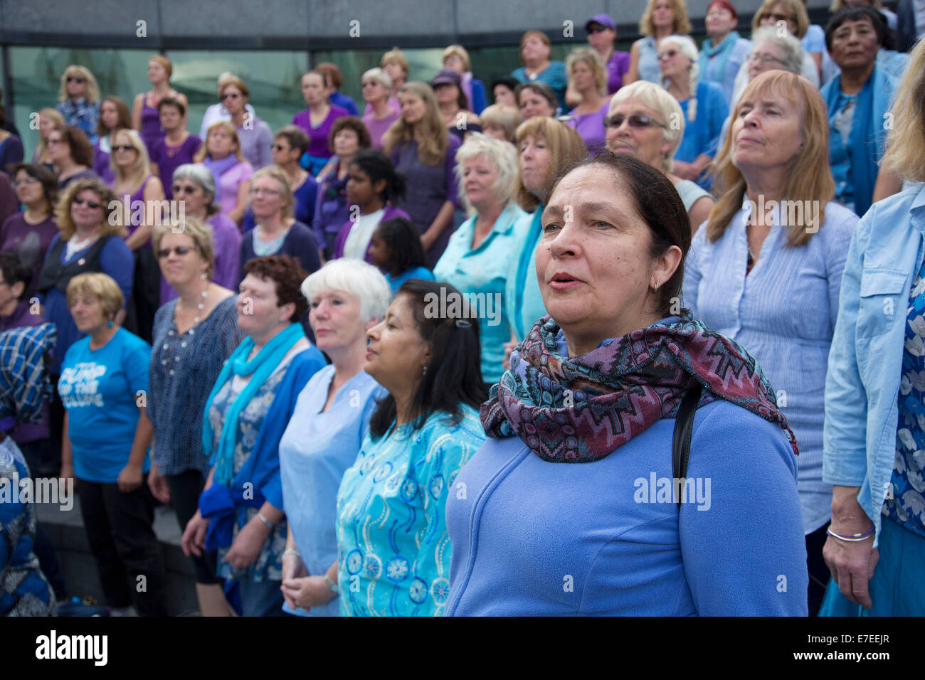 Adults choir, made from choirs from all over the region, perform at The Scoop. Totally Thames Festival, London, UK. Stock Photo