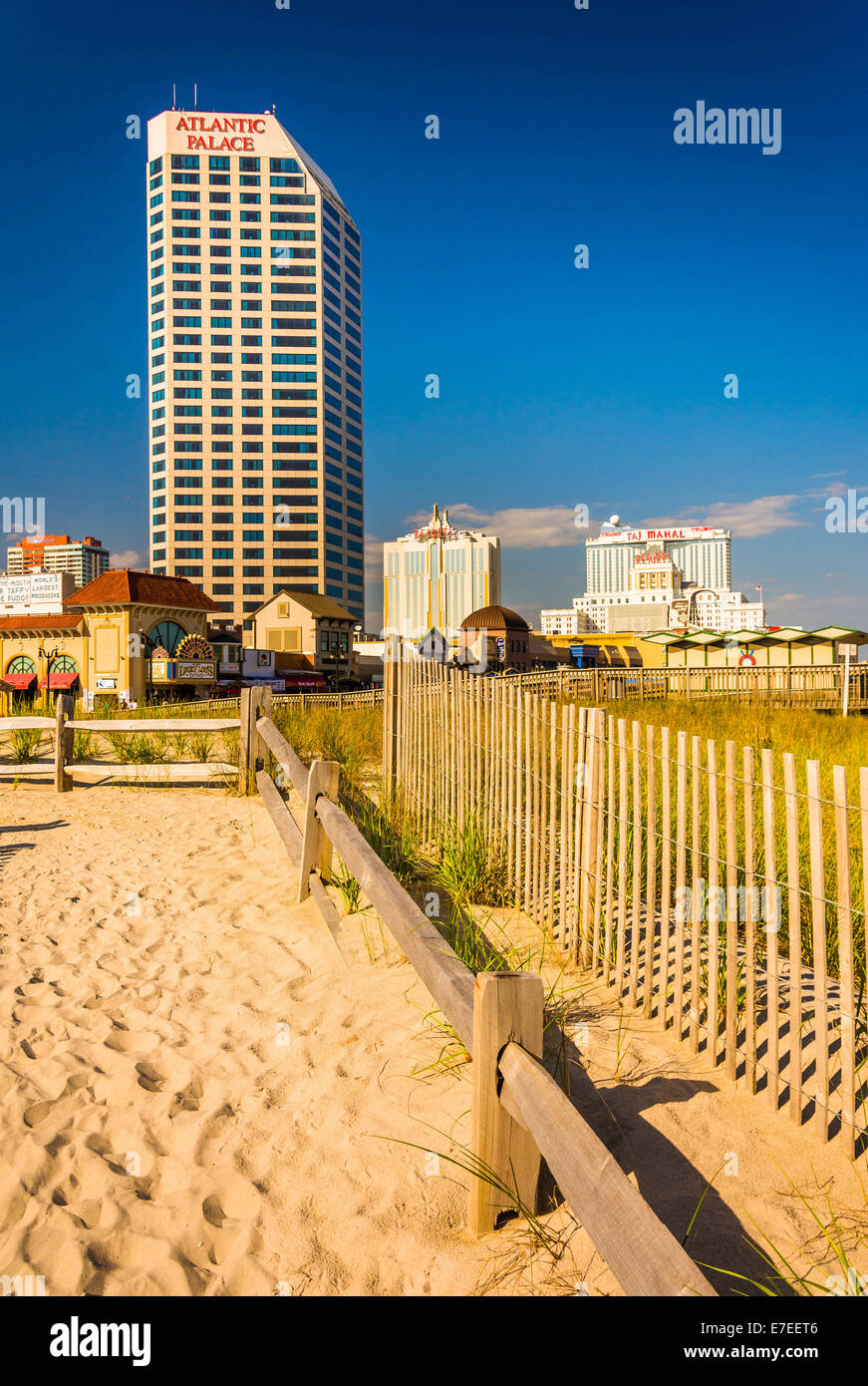 Path over sand dunes and buildings along the boardwalk in Atlantic City, New Jersey Stock Photo