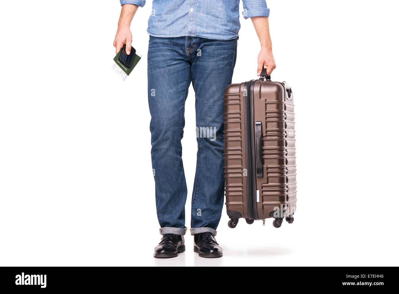 Man's legs and travel suitcase Stock Photo