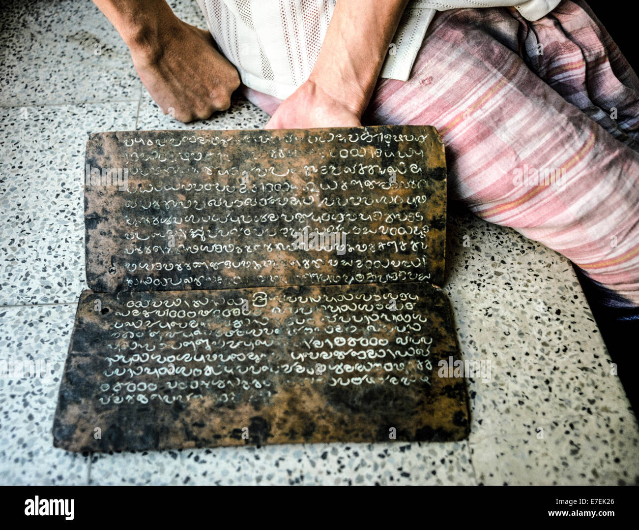 Priceless copper plates from the 10th Century with inscriptions in the Malayalam language that describe the privileges granted to local Jews are kept in the Paradesi Synagogue that was built in 1568 in Kochi (Cochin) in Kerala state, India. It is one of the oldest functioning synagogues in the world and welcomes visitors to view its other historical treasures that include a teak ark with scrolls of the Torah and gold and silver crowns, blue ceramic floor tiles brought from China in the 18th-Century, and glass chandeliers and lamps imported in the 1800s from Europe. Photographed in 1974. Stock Photo