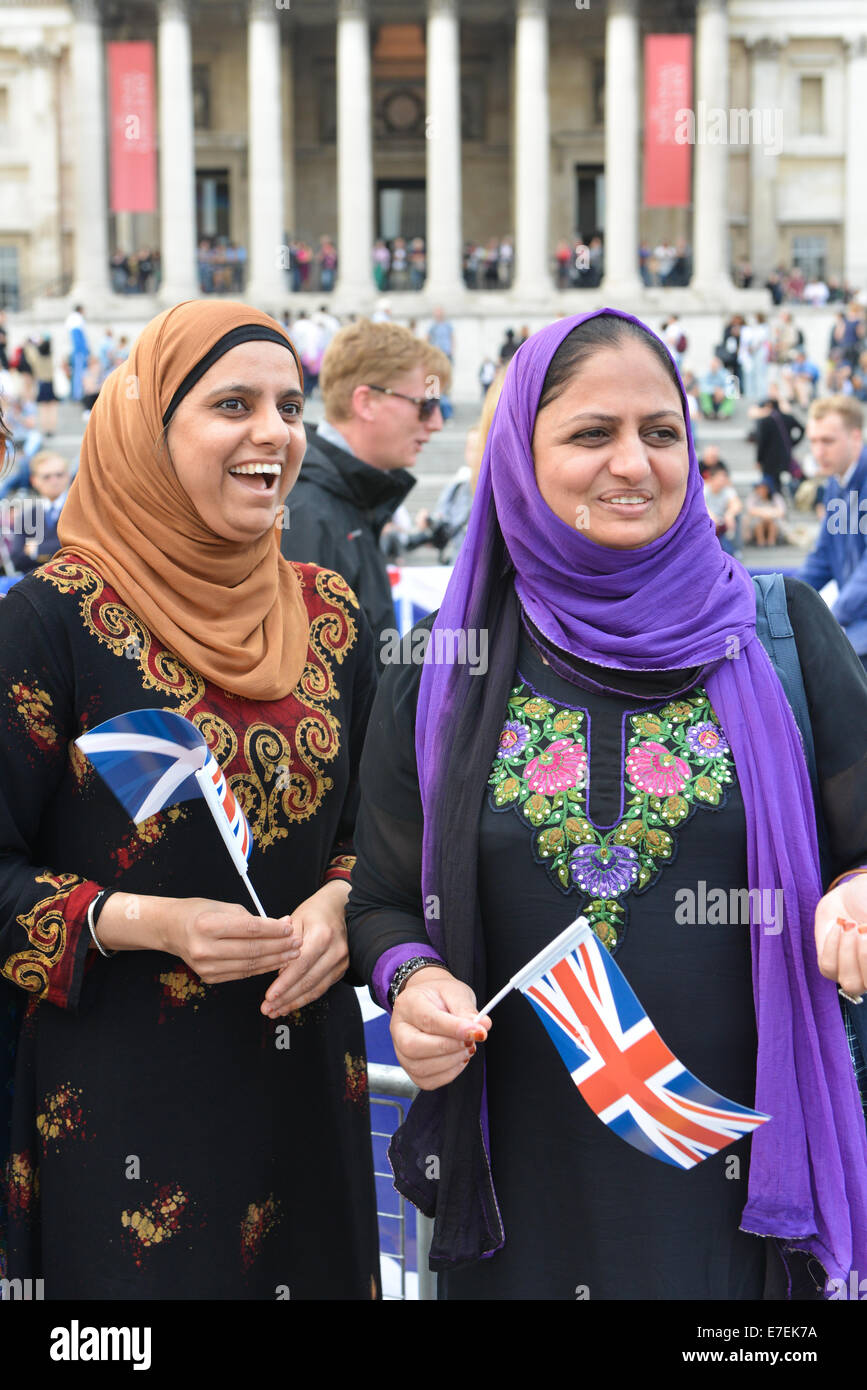 Trafalgar Square, London, UK. 15th September 2014. Two Asian ladies holding Union Jack flags at he say NO to Scottish Independence rally in Trafalgar Square. Credit:  Matthew Chattle/Alamy Live News Stock Photo
