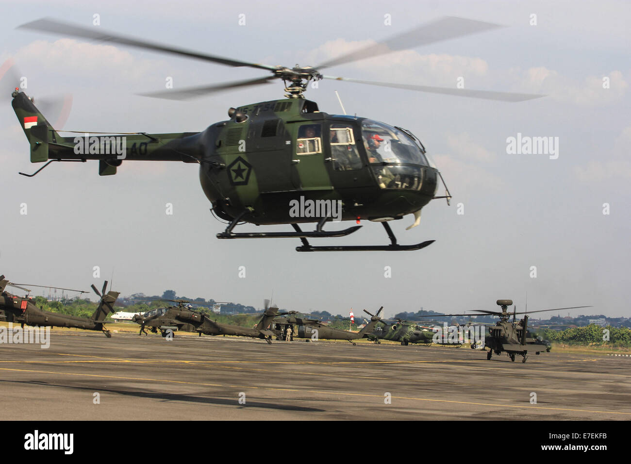 Semarang, Indonesia. 15th Sep, 2014. Military helicopters take part during the 8th Joint Exercise Garuda Shield 2014 at Army Air Base at Ahmad Yani Airport in Semarang, Central Java, Indonesia. Garuda Shield is the password for the joint exercise conducted by the Indonesian Army and the US Army and took place from 01 September to 29 September 2014 in Semarang and Asembagus, Situbondo, Indonesia. Credit:  WF Sihardian /Pacific Press/Alamy Live News Stock Photo