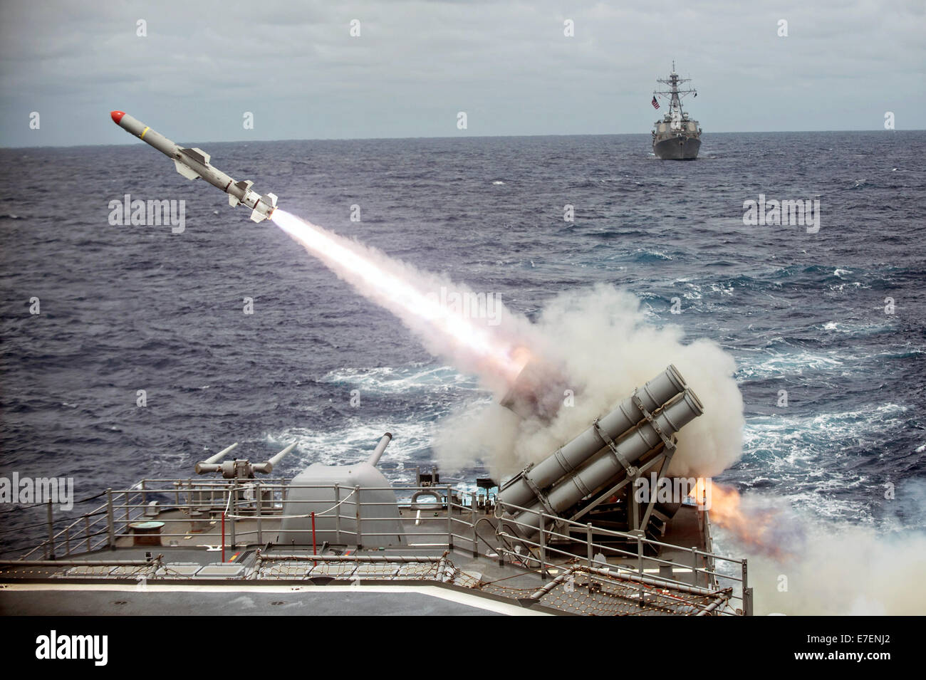 A Harpoon anti-ship missile is launched from the Ticonderoga-class guided-missile cruiser USS Shiloh during exercise Valiant Shield 2014 September 15, 2014 off the coast of Guam. Stock Photo