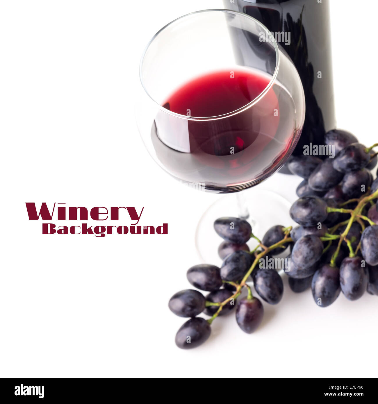 Glass of red wine with bunch of grapes and bottle isolated on white ...