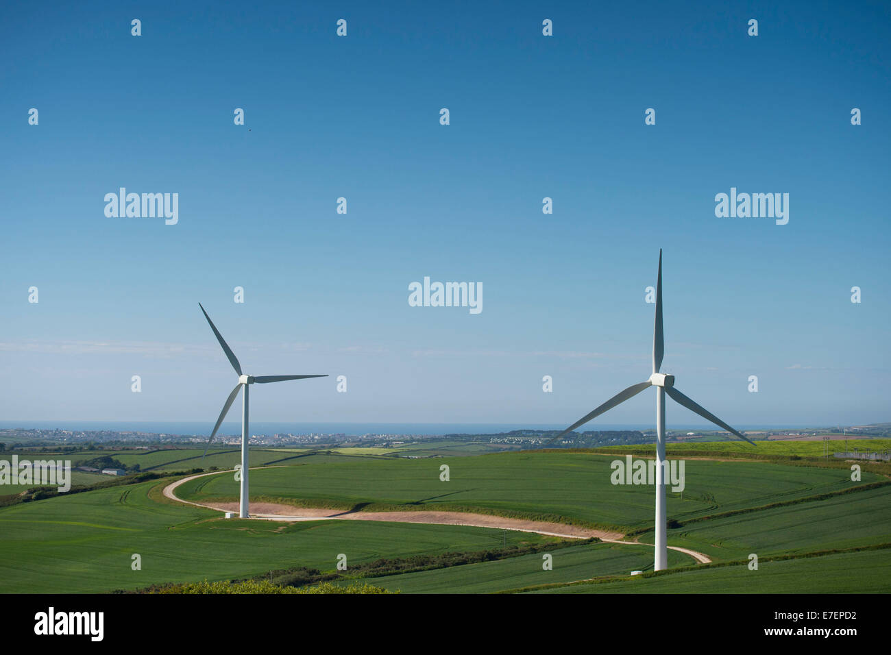 Wind turbines producing green renewable energy in Cornwall, England