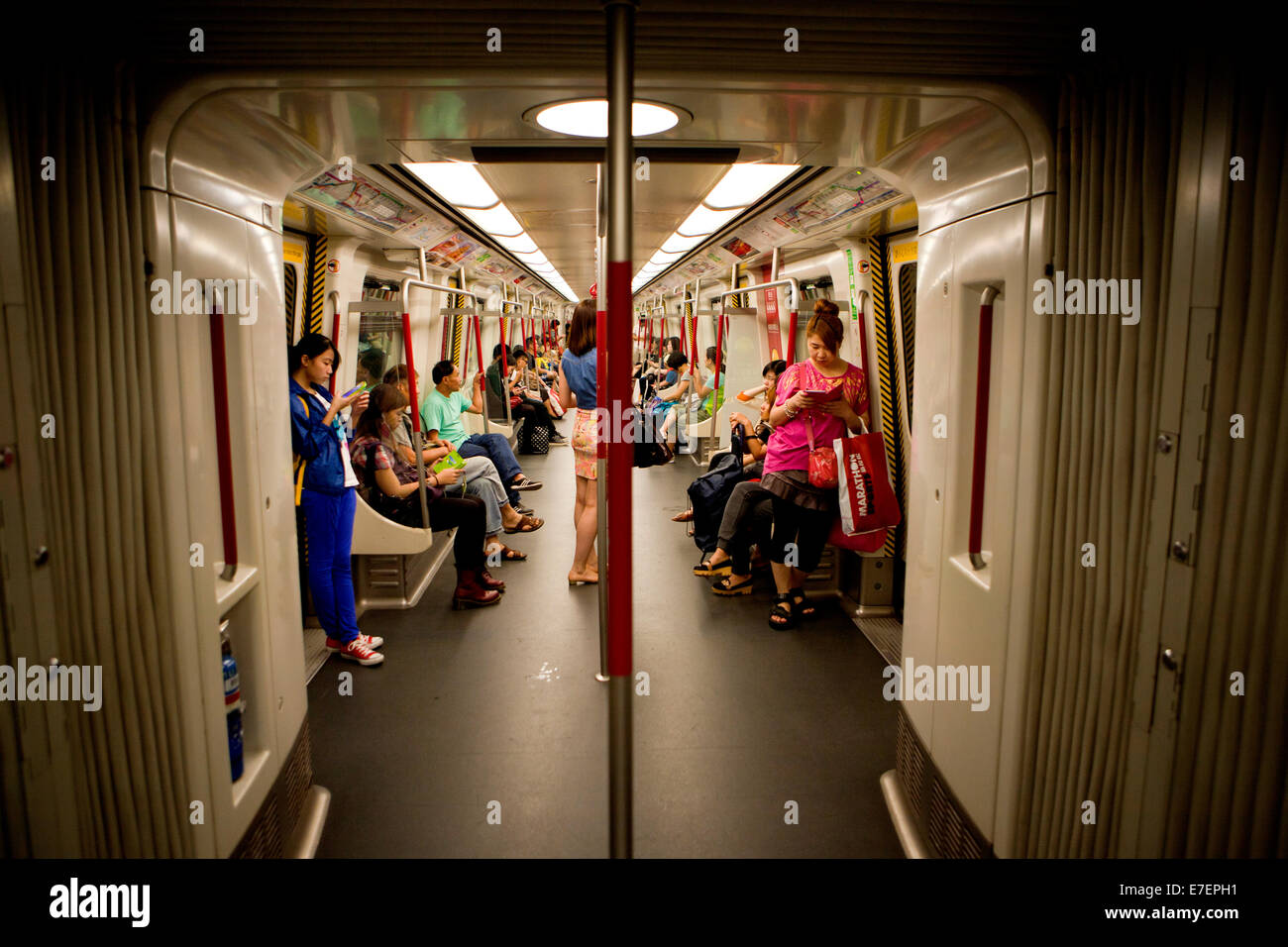 Inside the Honk Kong Subway. Hong Kong Island is an island in the southern part of the Hong Kong Special Administrative Region. It has a population of 1,289,500. The island had a population of 3,000 inhabitants scattered in a dozen fishing villages when it was occupied by the United Kingdom in the First Opium War. . The island was occupied by China in 1997 under the 1984 Sino-British Joint Declaration. Stock Photo