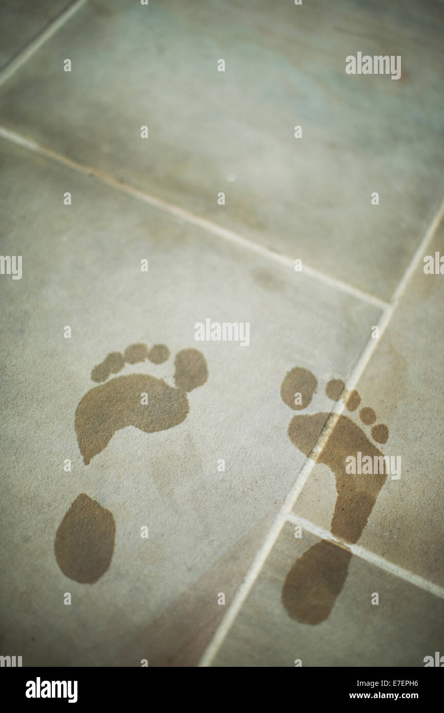 wet footsteps by pool Stock Photo