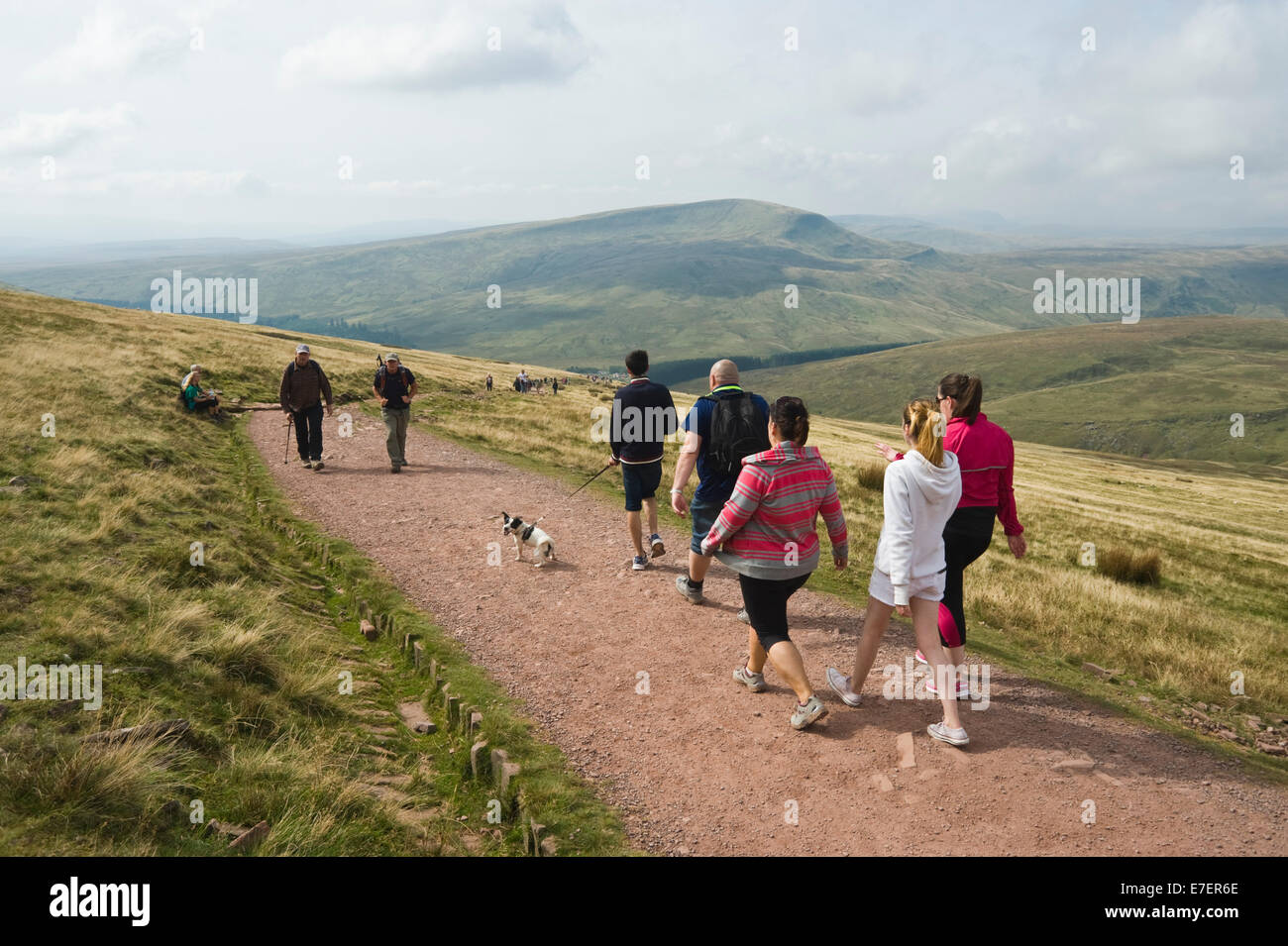 Walkers on footpath to Pen Y Fan in Brecon Beacons National Park Powys South Wales UK Stock Photo