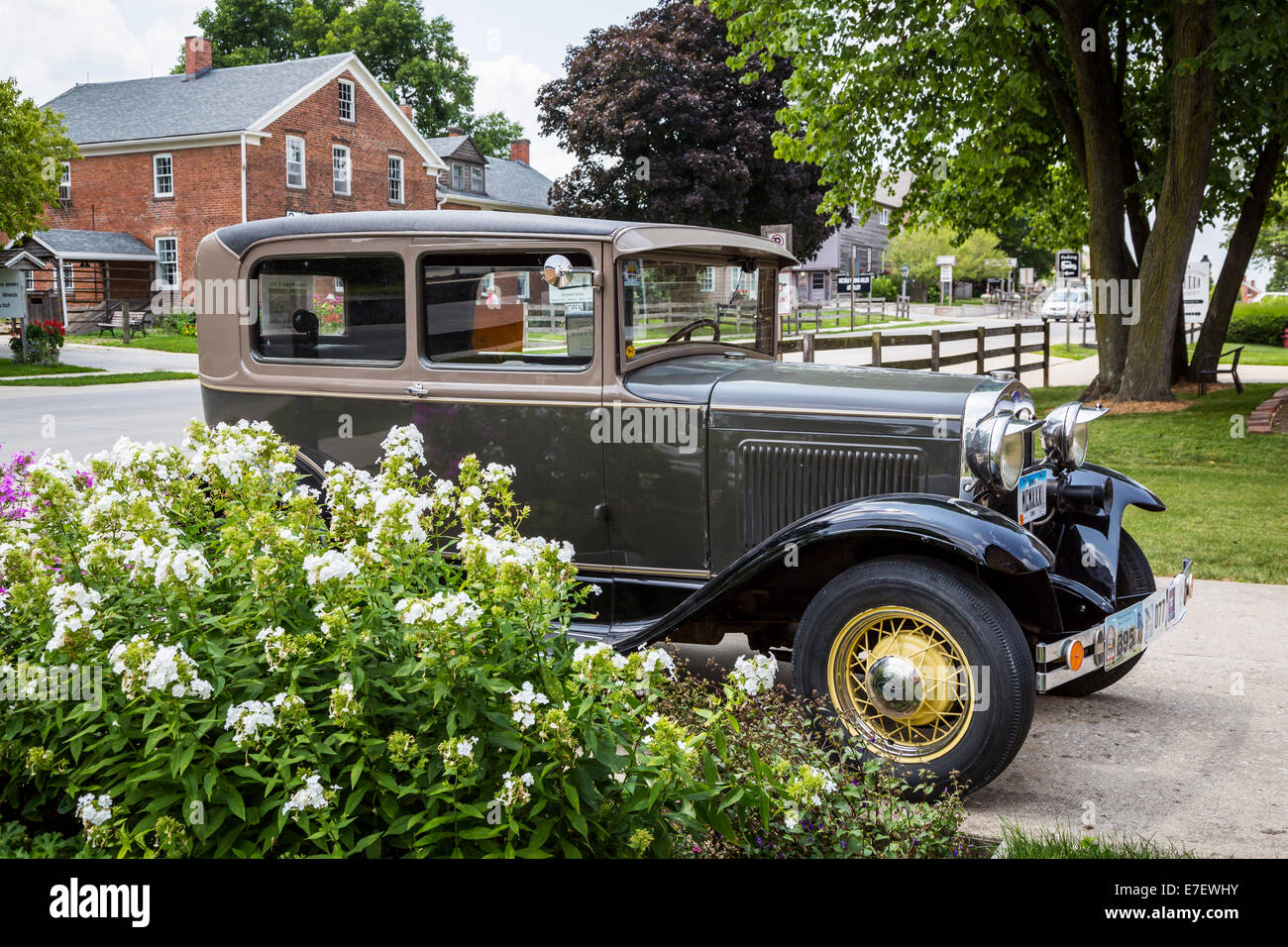 An antique car and a German home in the Amana Colonies, Iowa, USA. Stock Photo