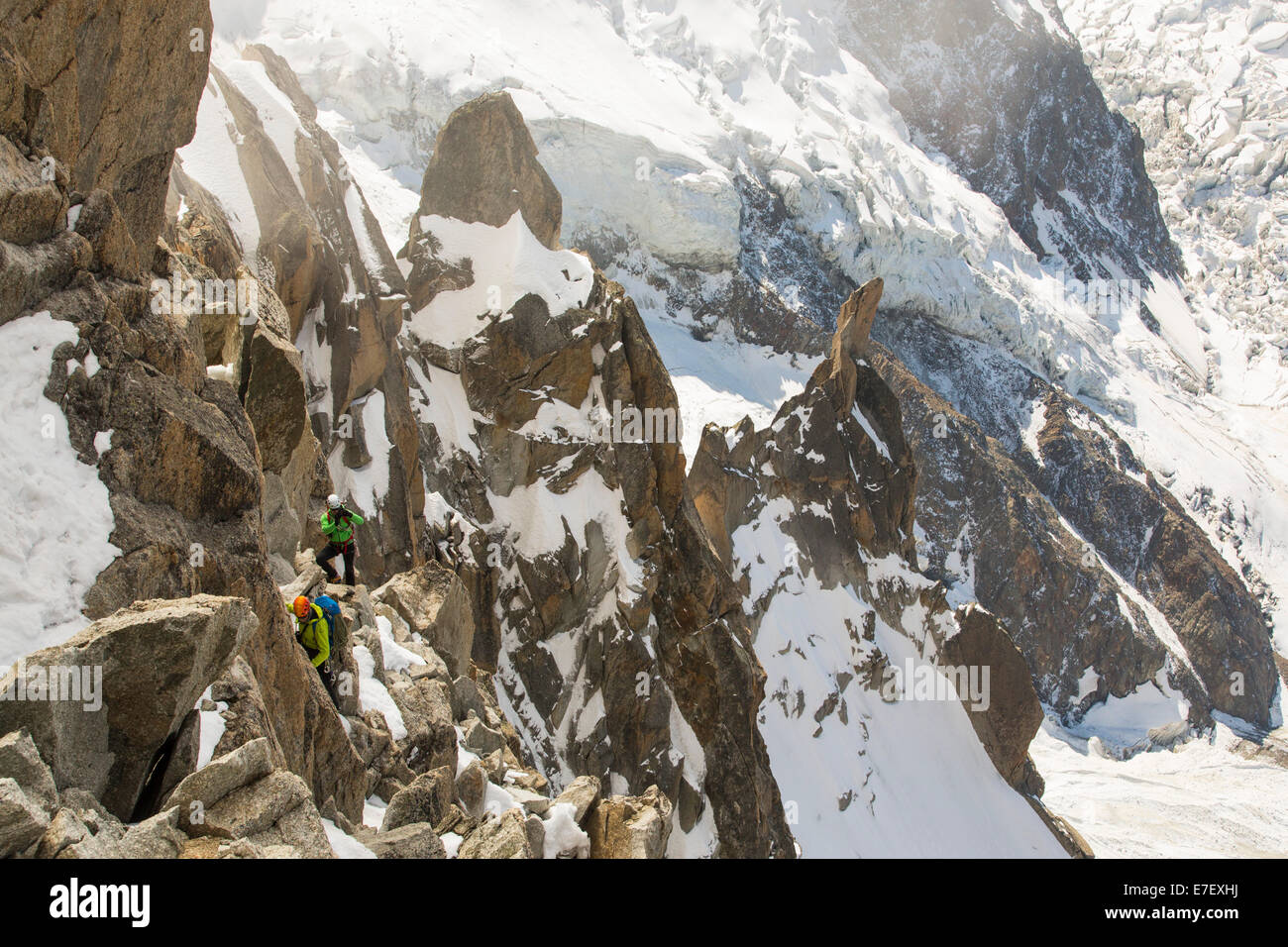 Mont Blanc and the Bossons glacier from the Aiguille Du Midi, France, with climbers on the Cosmiques Arete. Stock Photo