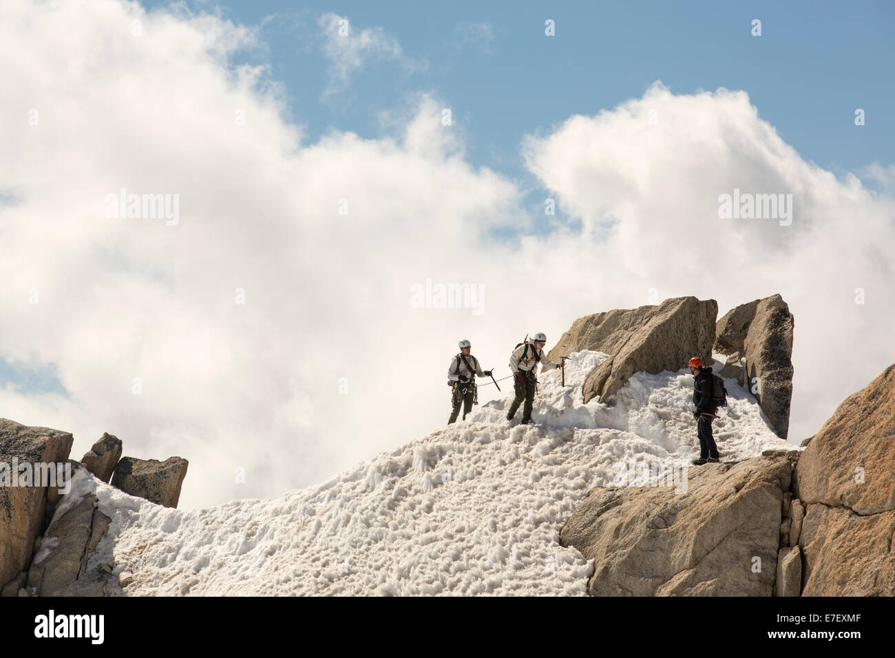 Climbers on the Cosmiques Arete on the Aiguille du Midi above Chamonix, France. Stock Photo