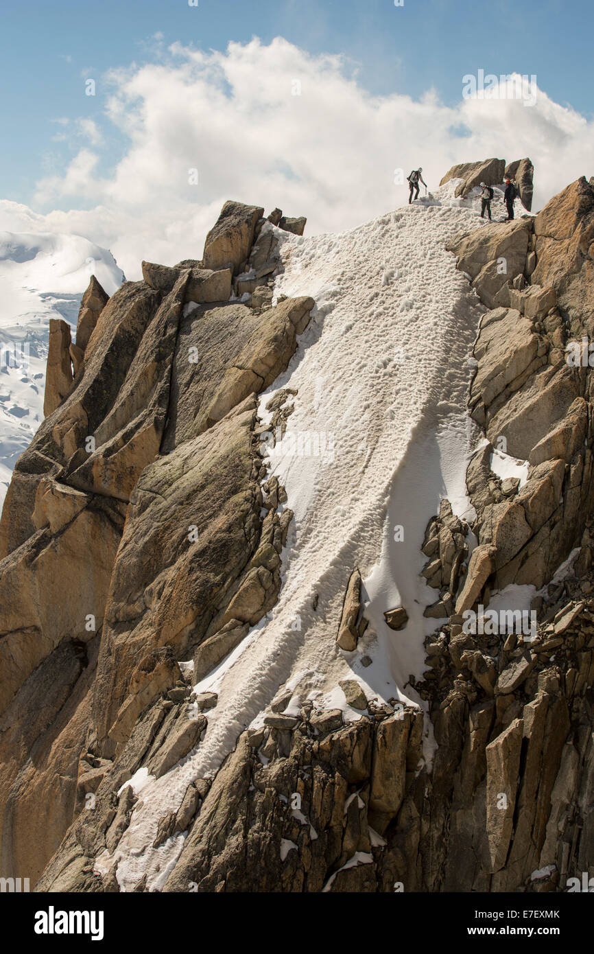 Climbers on the Cosmiques Arete on the Aiguille du Midi above Chamonix, France. Stock Photo
