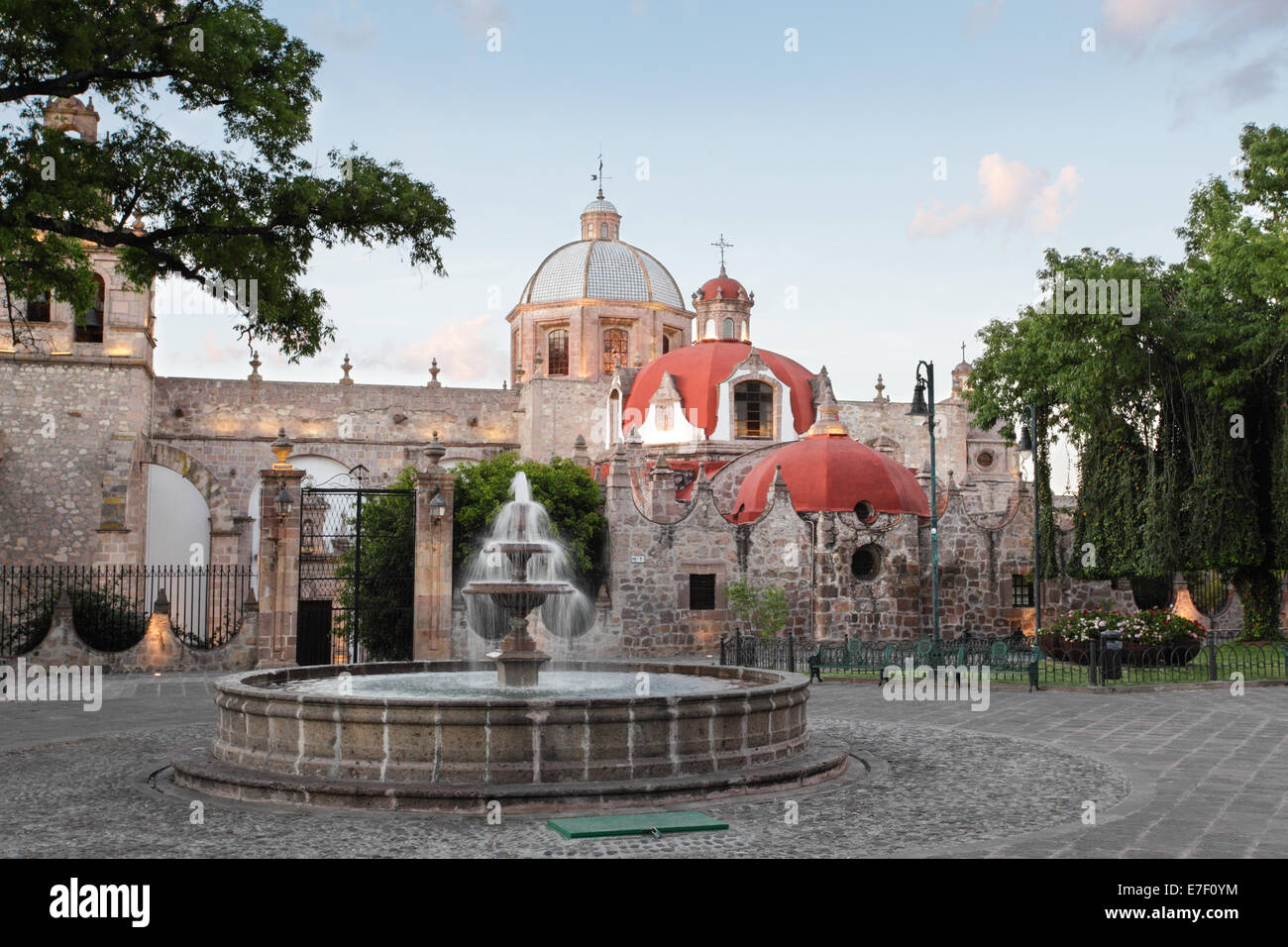 Plaza and red domes of El Carmen church, Morelia, Michoacan, Mexico. Stock Photo