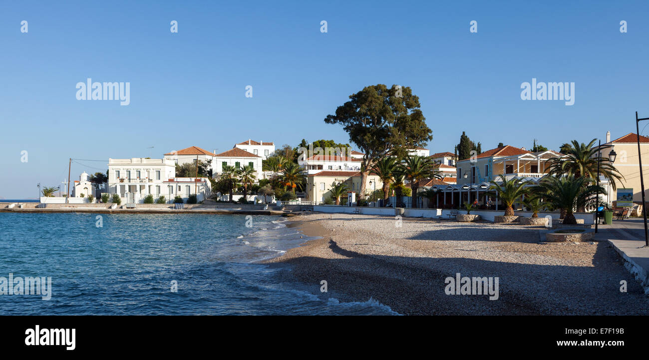 Spetses Town beach promenade and buildings. The Greek Aegean island is popular with the more affluent class of traveller. Stock Photo