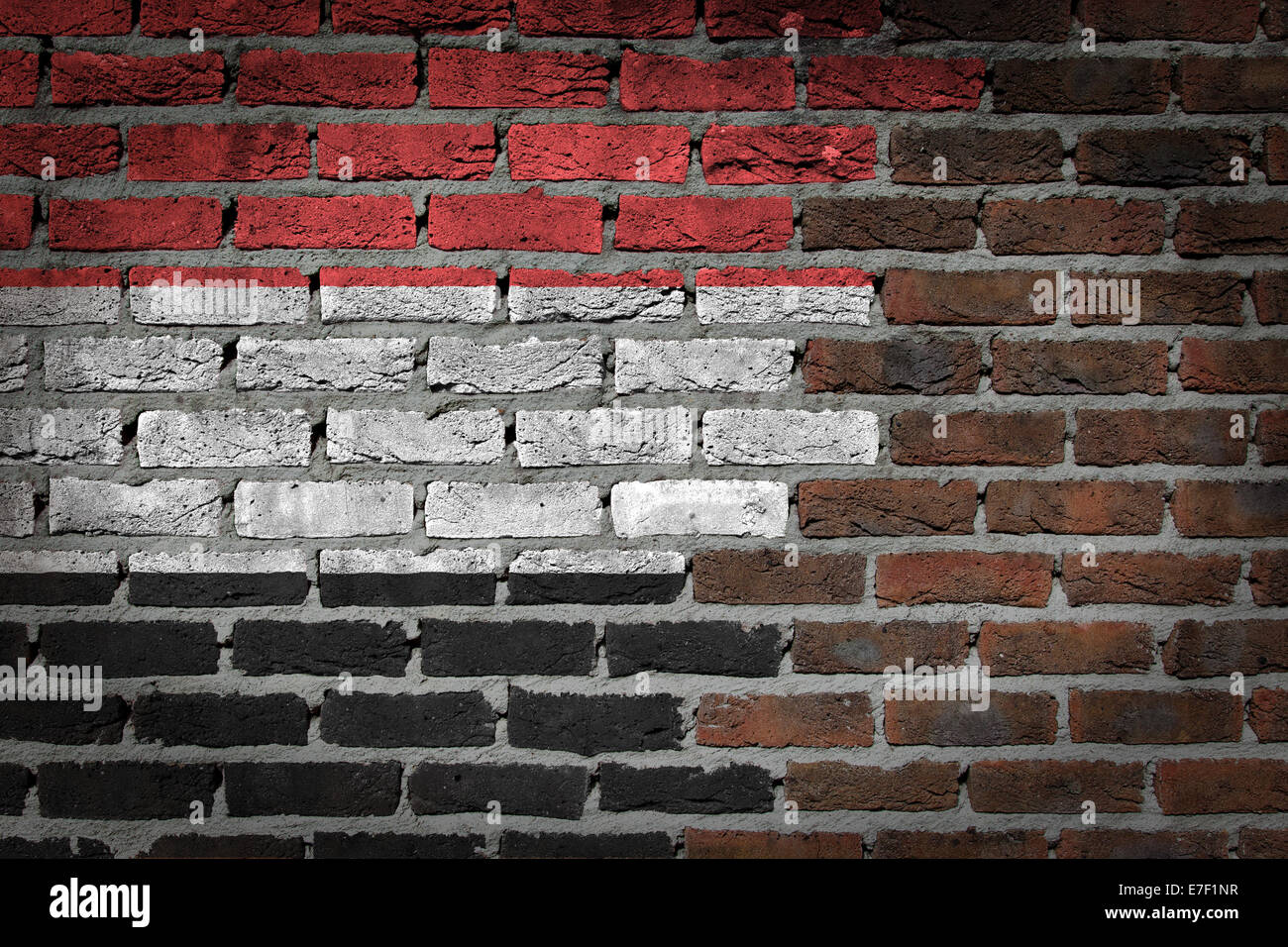 Dark brick wall texture - flag painted on wall - Yemen Stock Photo - Alamy