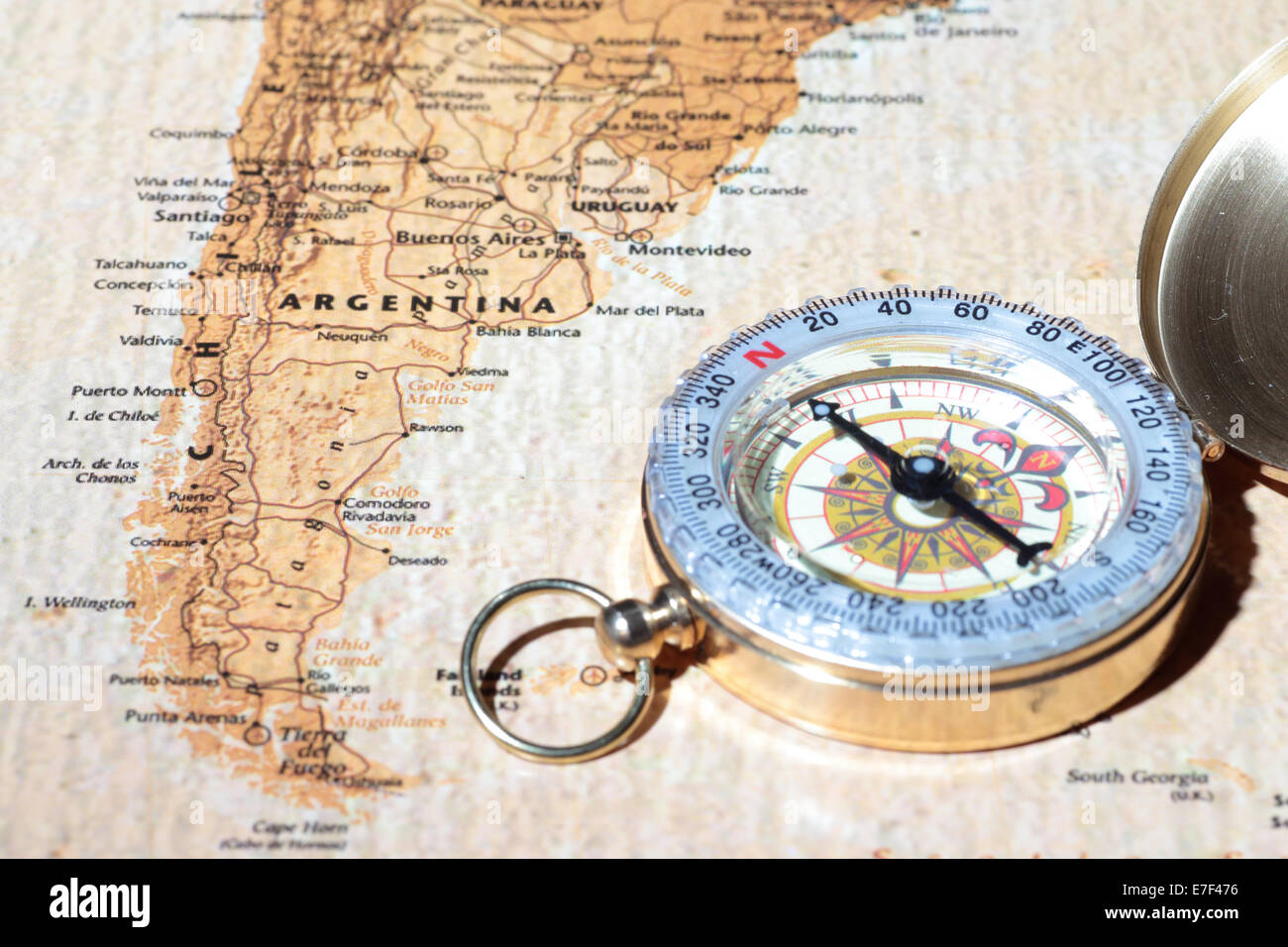 Compass on a map pointing at Argentina, planning a travel destination Stock Photo