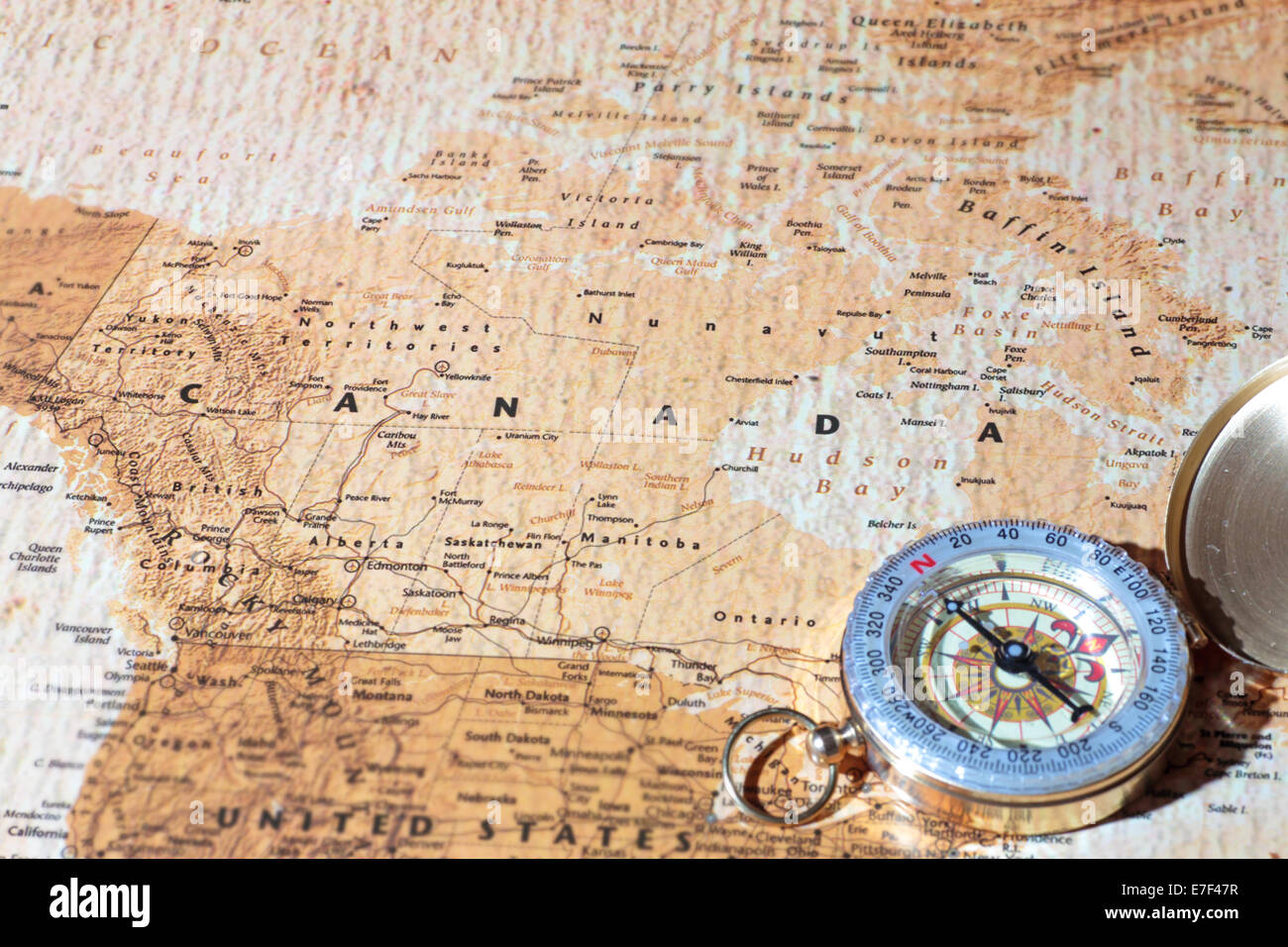 Compass on a map pointing at Canada, planning a travel destination Stock Photo