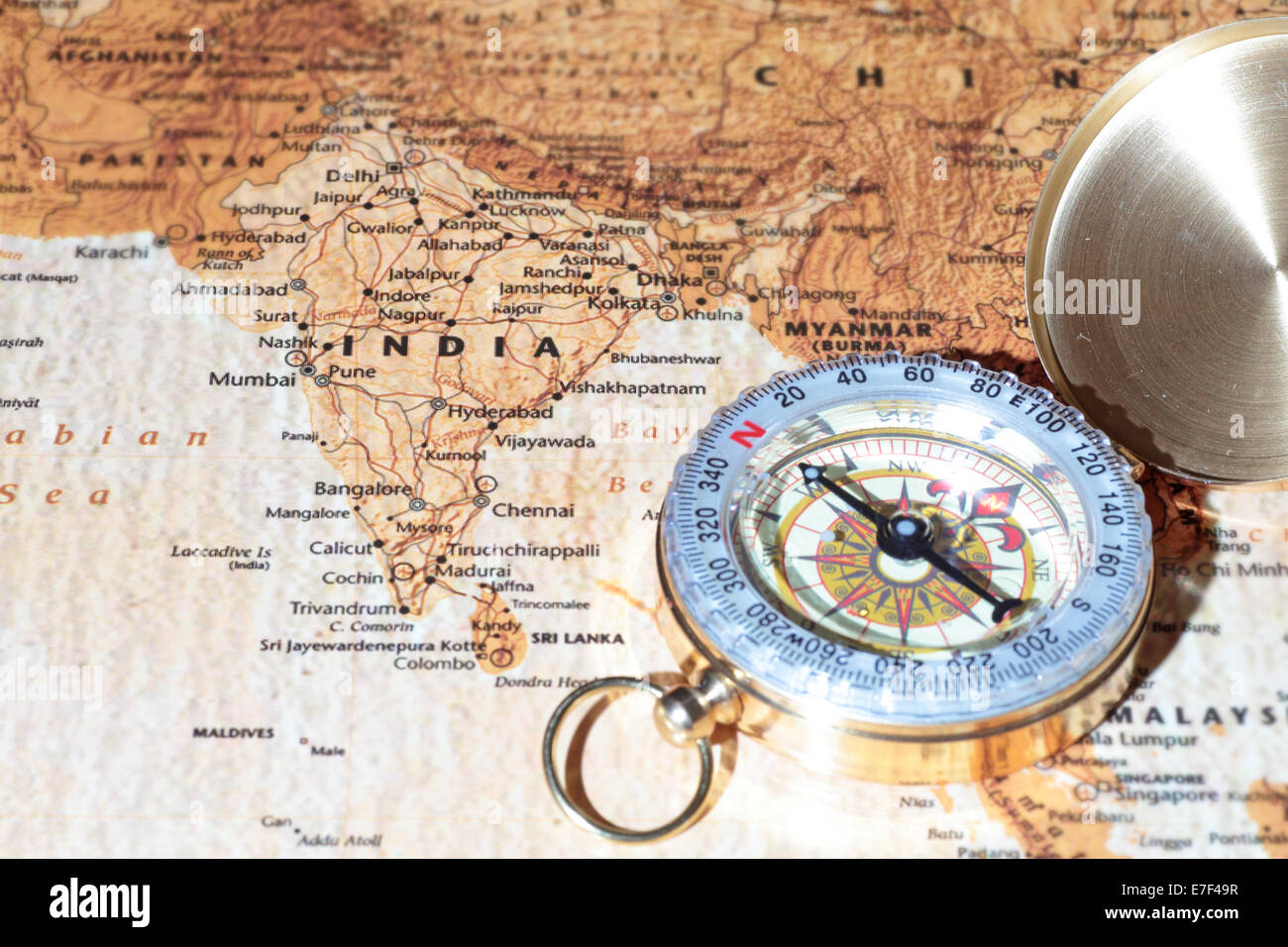 Compass on a map pointing at India, planning a travel destination Stock Photo