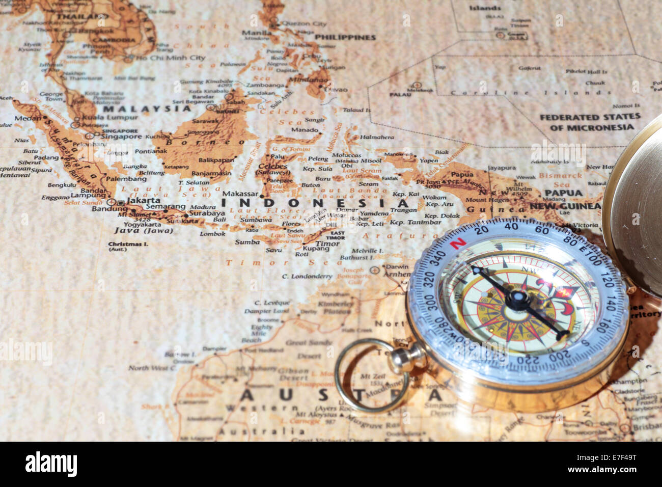 Compass on a map pointing at Indonesia, planning a travel destination Stock Photo