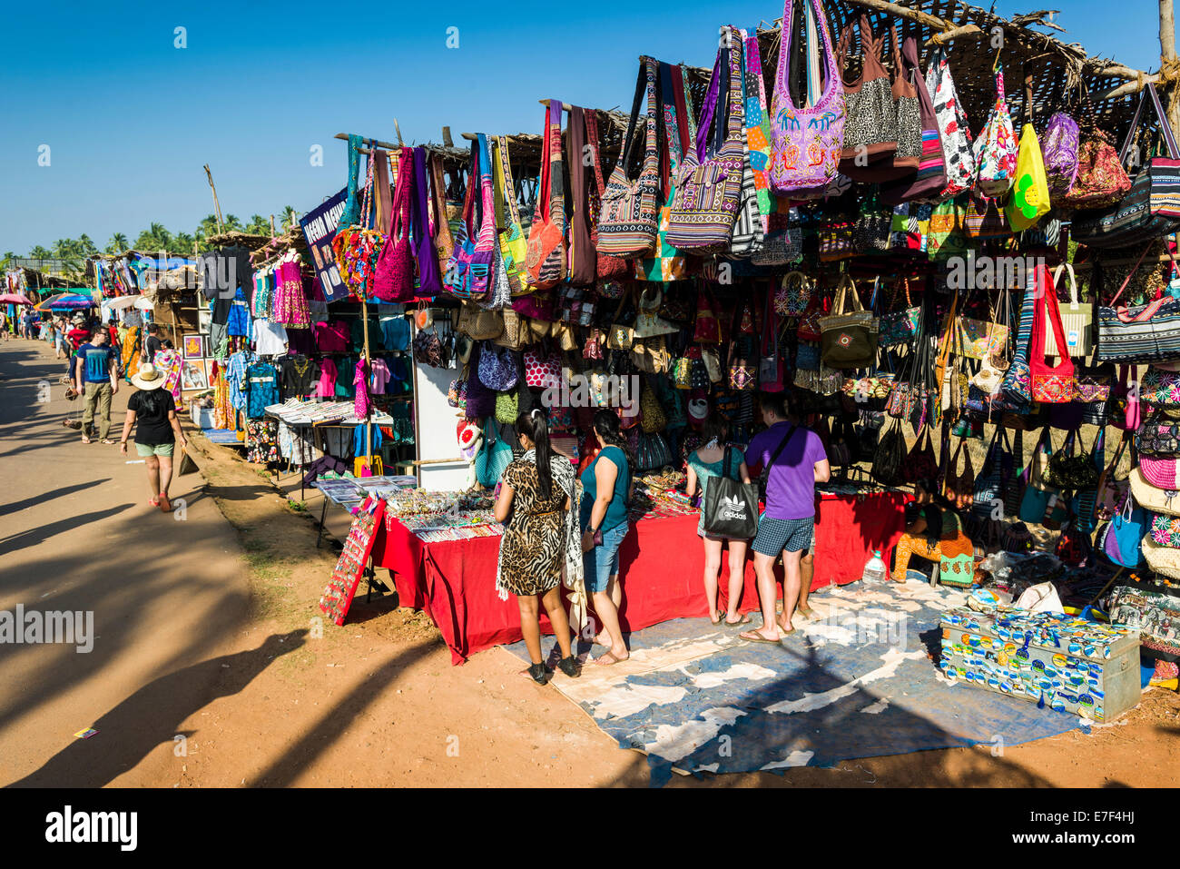Colourful bags for sale at the weekly flea market, Anjuna, Goa, Stock - Alamy