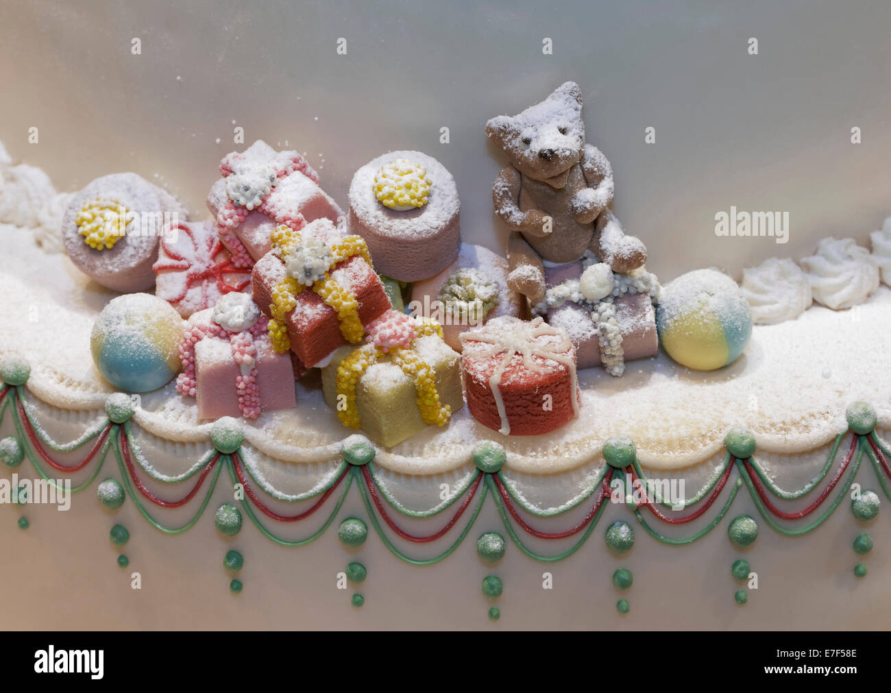 Christmas gifts and a teddy bear made of marzipan, decoration on a cake, Düsseldorf, North Rhine-Westphalia, Germany Stock Photo