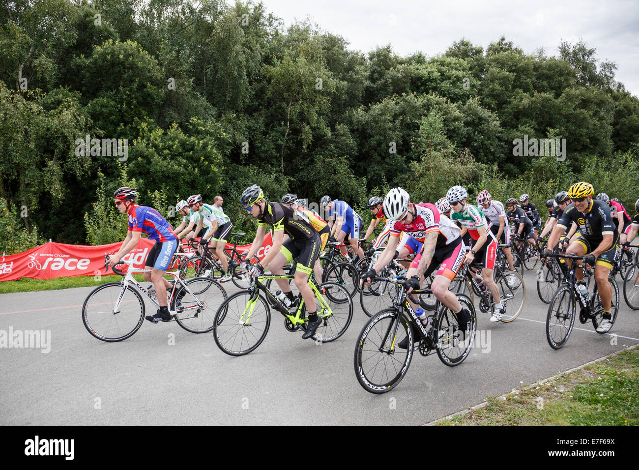 Men's Criterium bike race riders setting off from a standing start organised by British Cycling at Fowlmead Country Park Kent UK Stock Photo