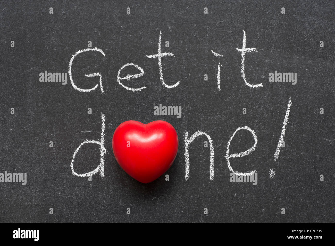 get it done exclamation handwritten on chalkboard with heart symbol instead of O Stock Photo