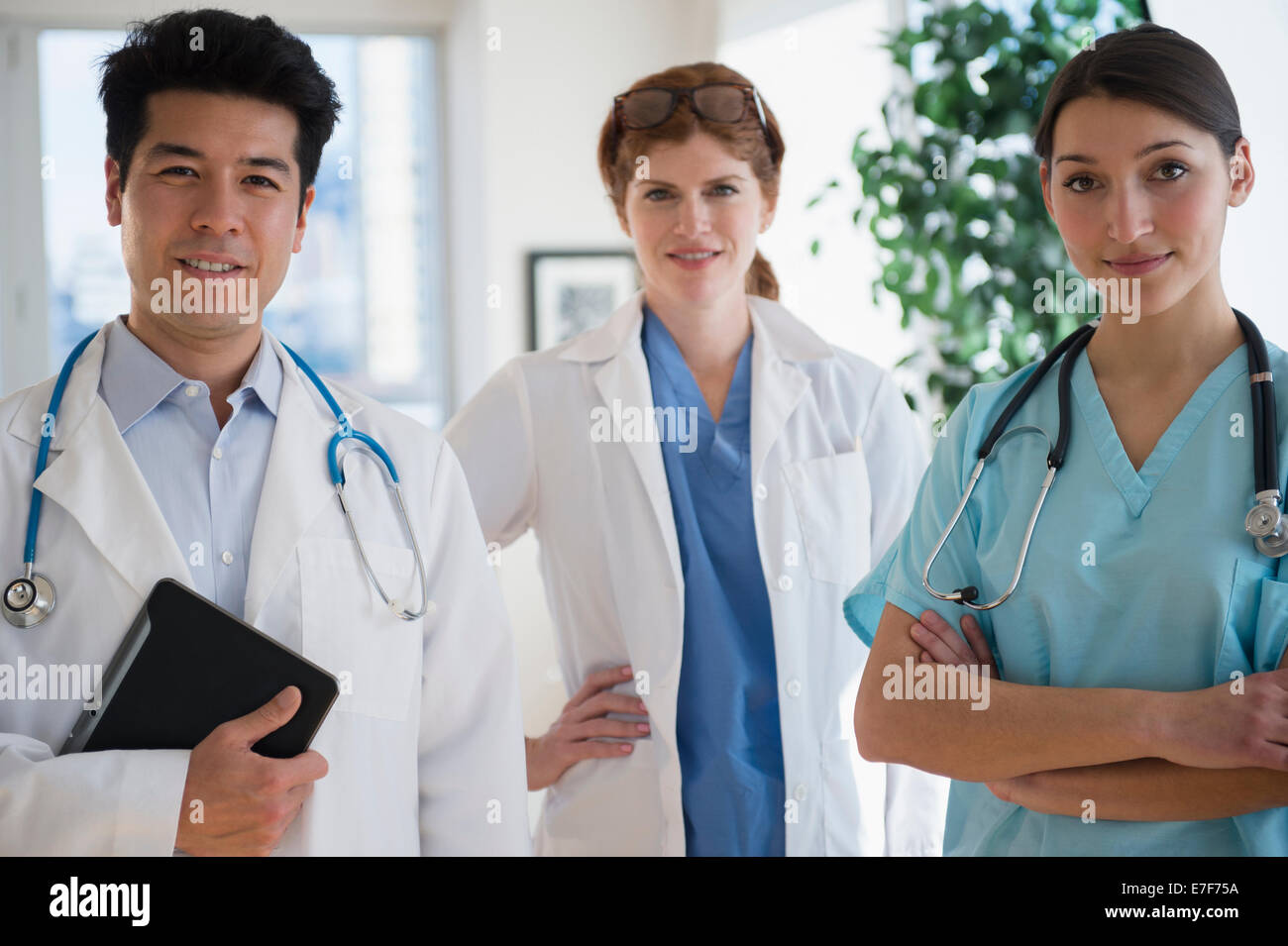 Doctors and nurse smiling in office Stock Photo Alamy