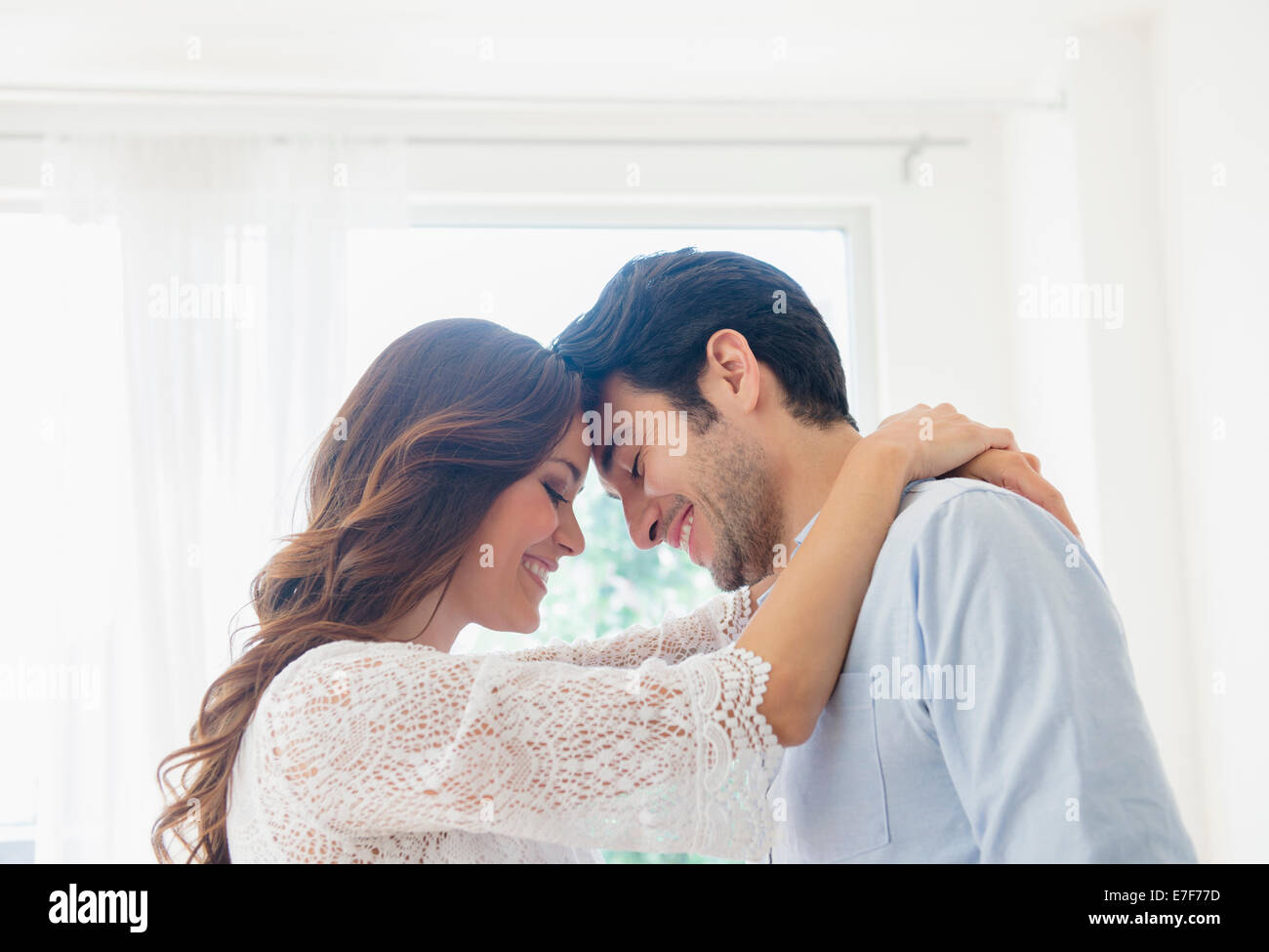 Smiling couple hugging Stock Photo