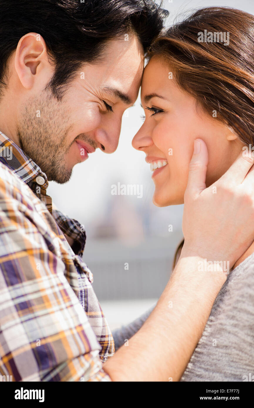Woman touching boyfriend face hi-res stock photography and images