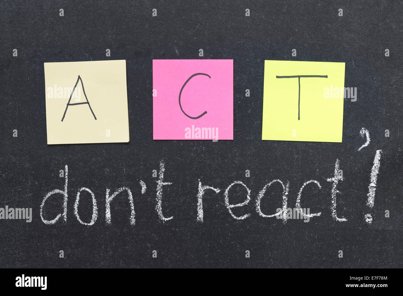 ACT, do not react phrase handwritten on blackboard Stock Photo