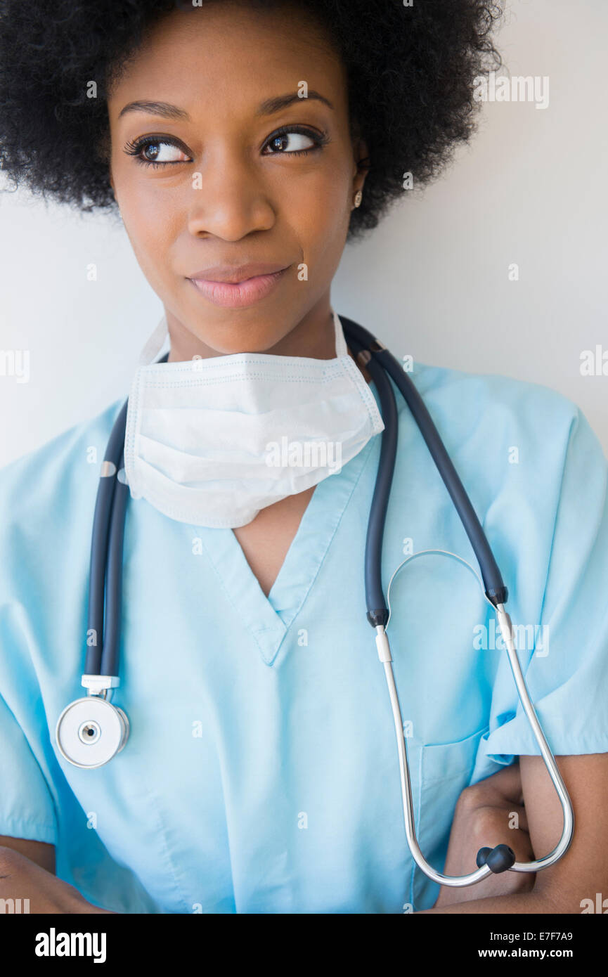African American nurse wearing stethoscope and surgical mask Stock Photo