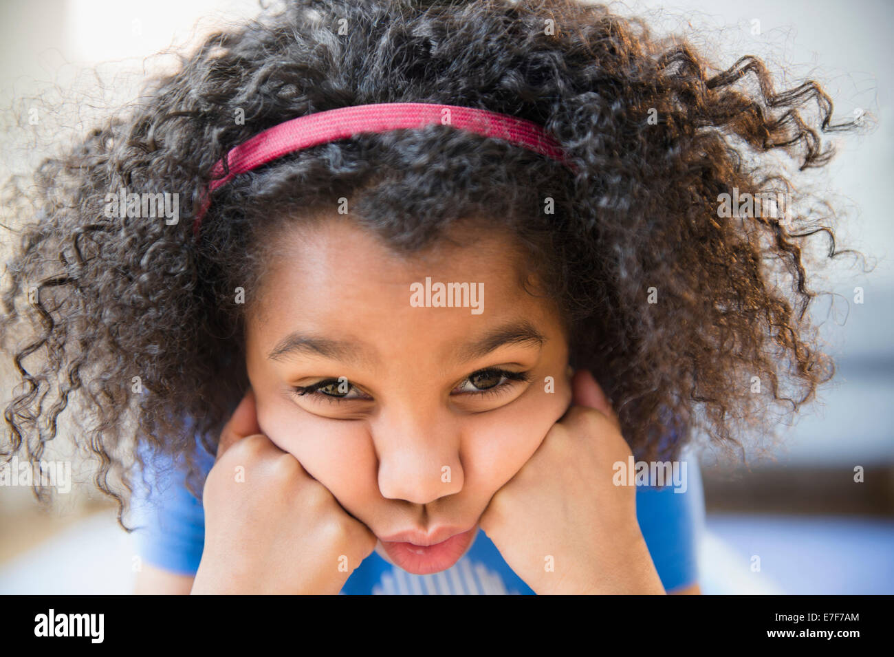Close up of African American girl making a face Stock Photo