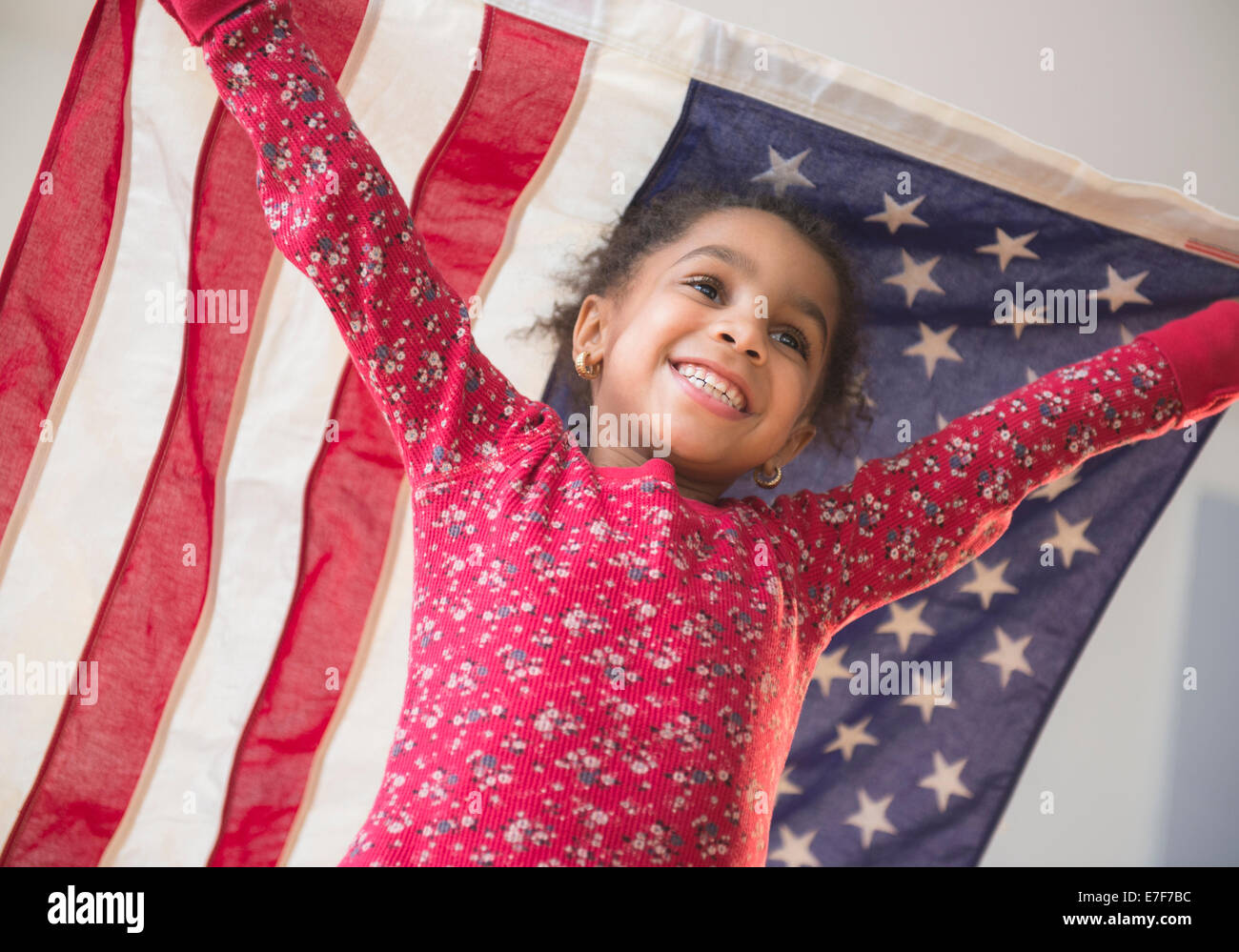 African American girl playing with United States flag Stock Photo - Alamy