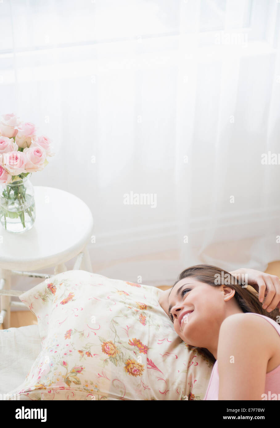 Woman relaxing on bed Stock Photo