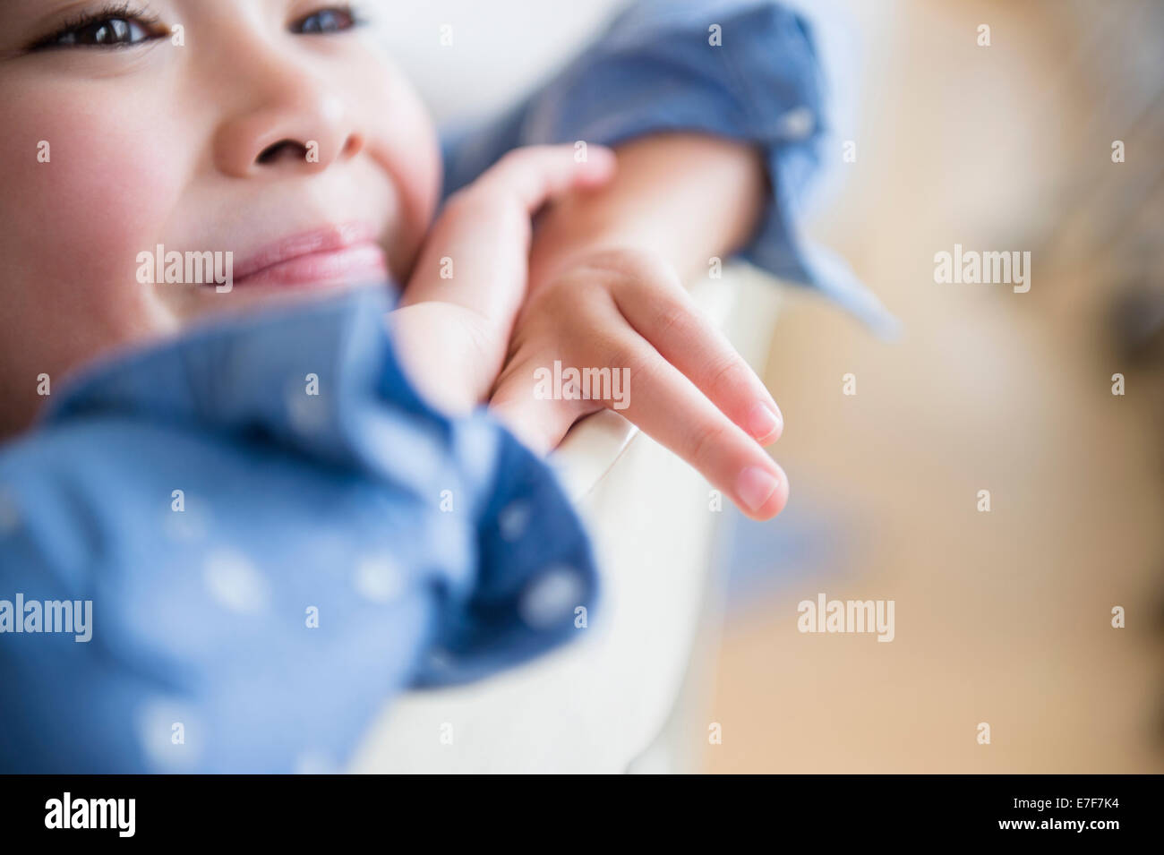 Close up of Filipino girl resting chin in hands Stock Photo