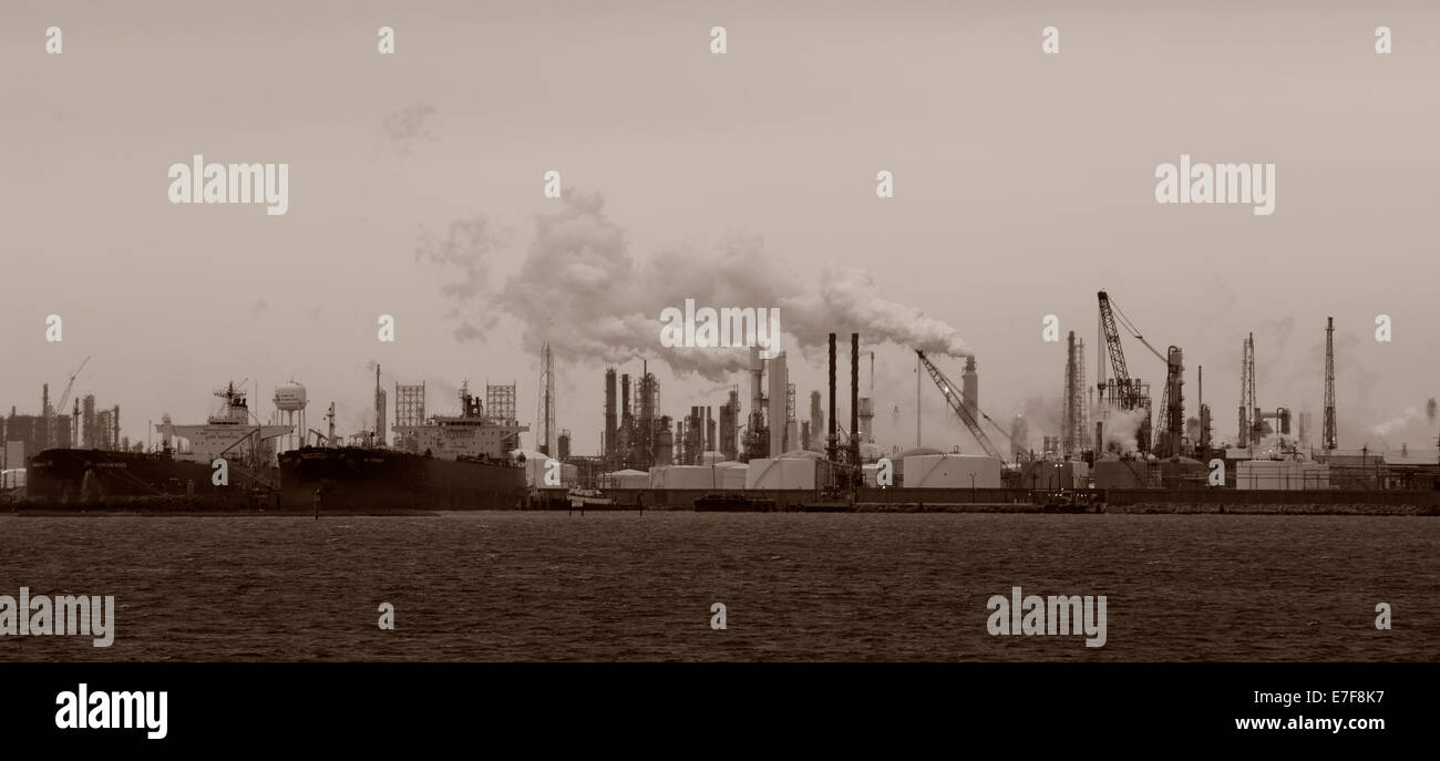 Smoke billowing from distant factory Stock Photo