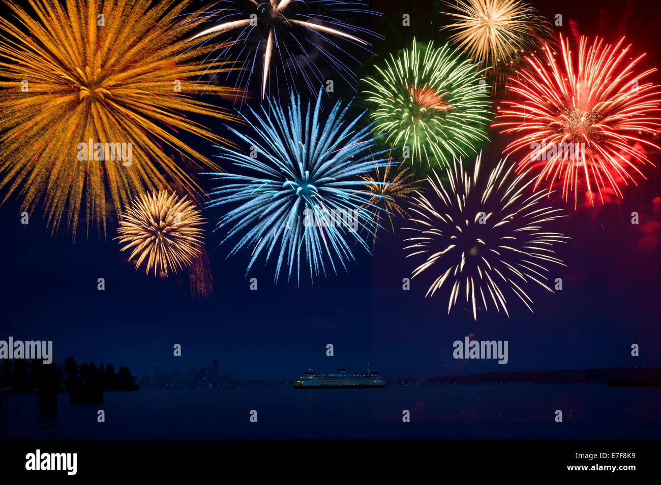 Fireworks exploding over cruise ship in bay, Seattle, Washington, United States Stock Photo