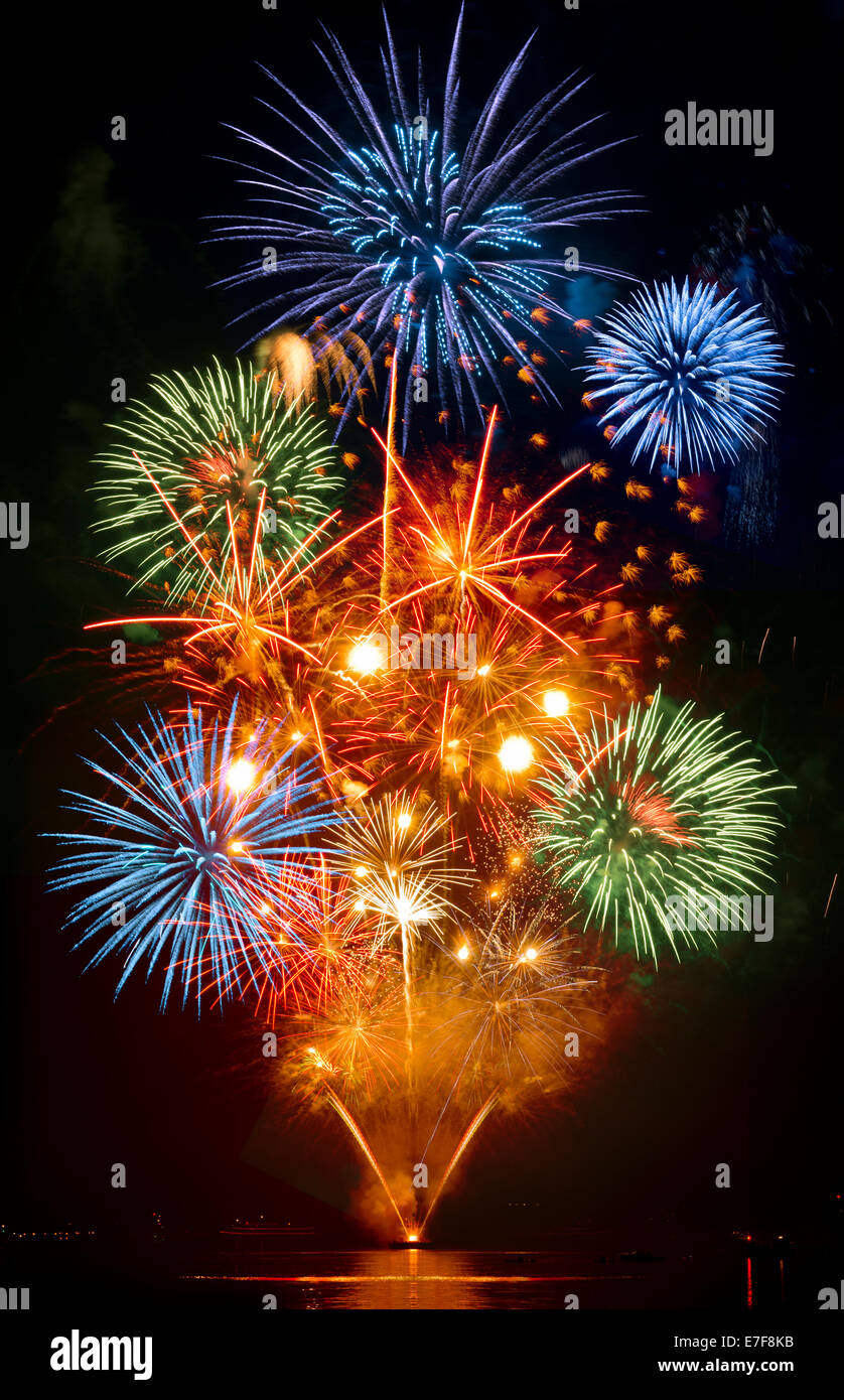 Fireworks exploding over cruise ship in harbor, Seattle, Washington, United States Stock Photo