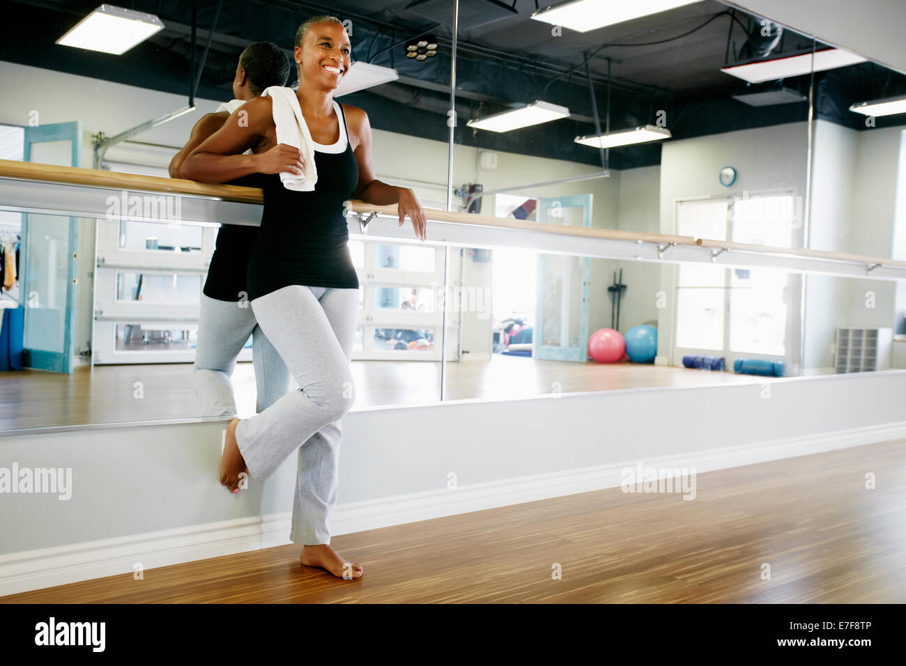 Woman relaxing in yoga studio Stock Photo