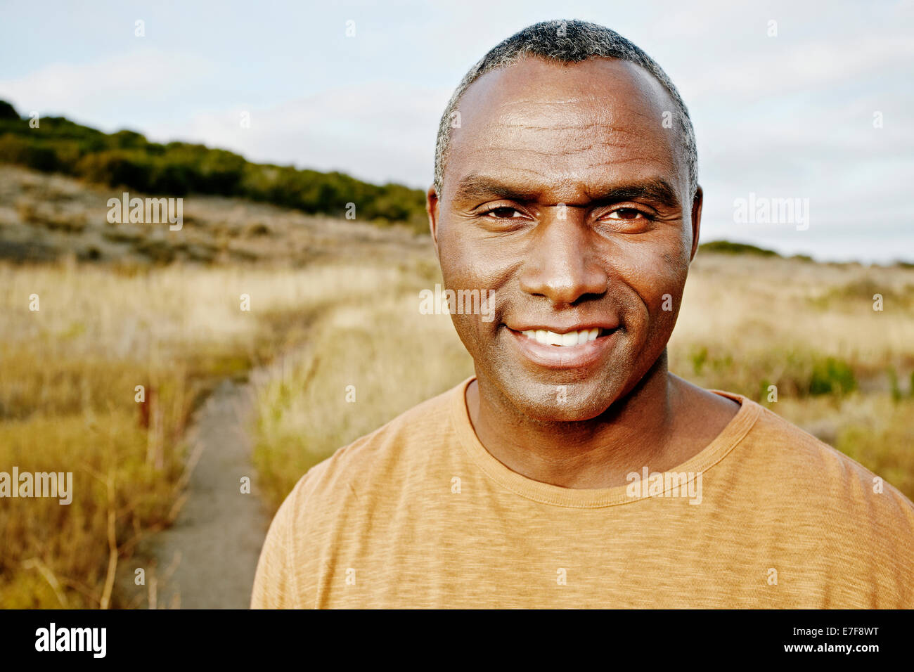 Man black hair standing hi-res stock photography and images - Alamy