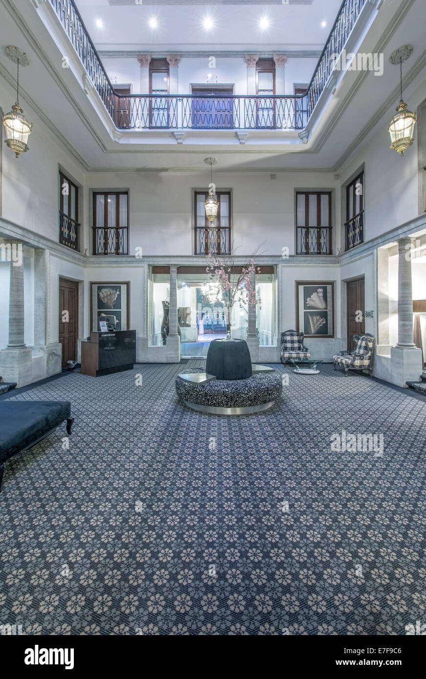Seating and carpet in ornate hotel lobby Stock Photo