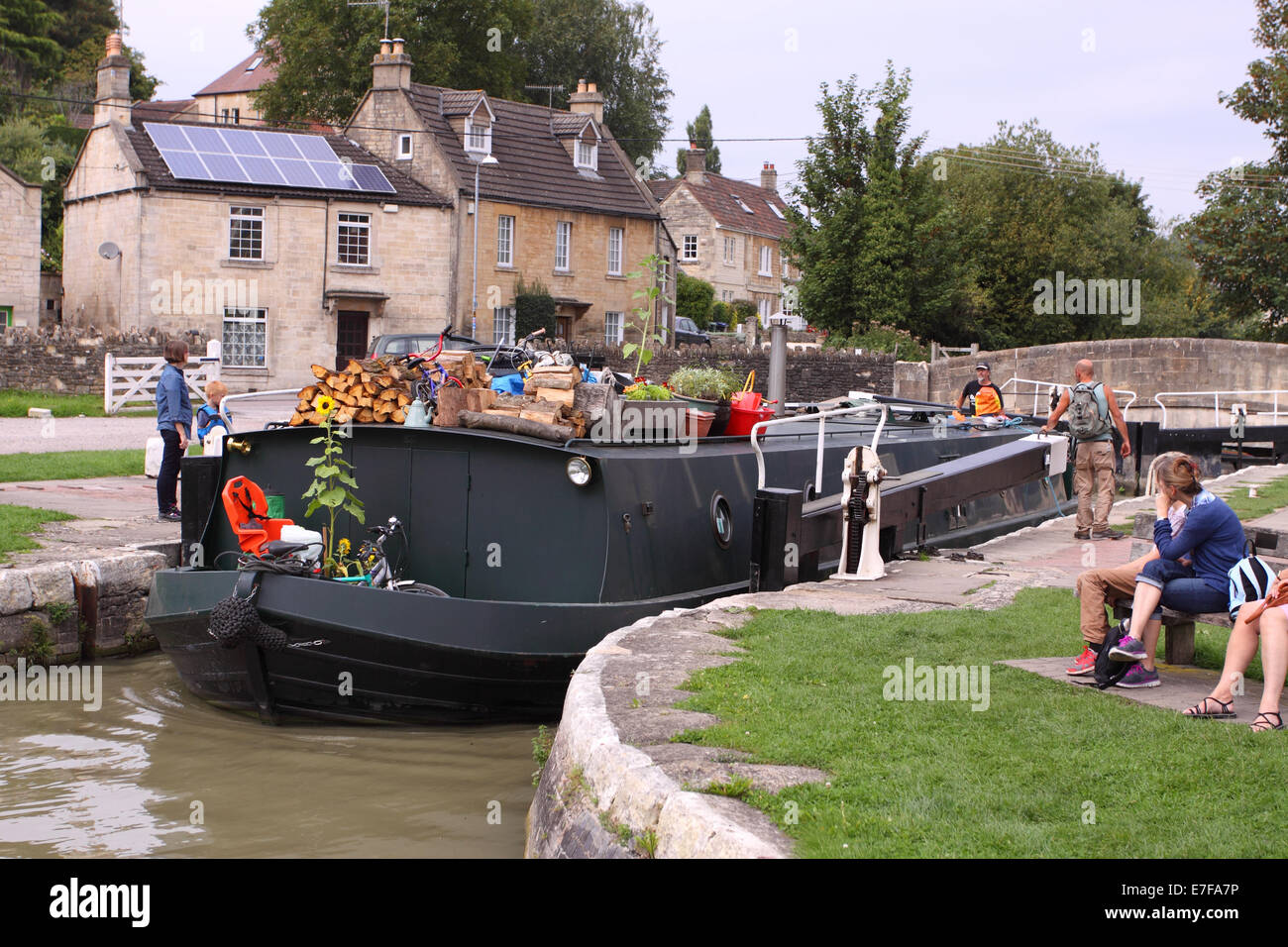 Bradford On Avon a canal narrowboat passes through Bradford Lock on the Avon and Kennett canal in Wiltshire UK Stock Photo